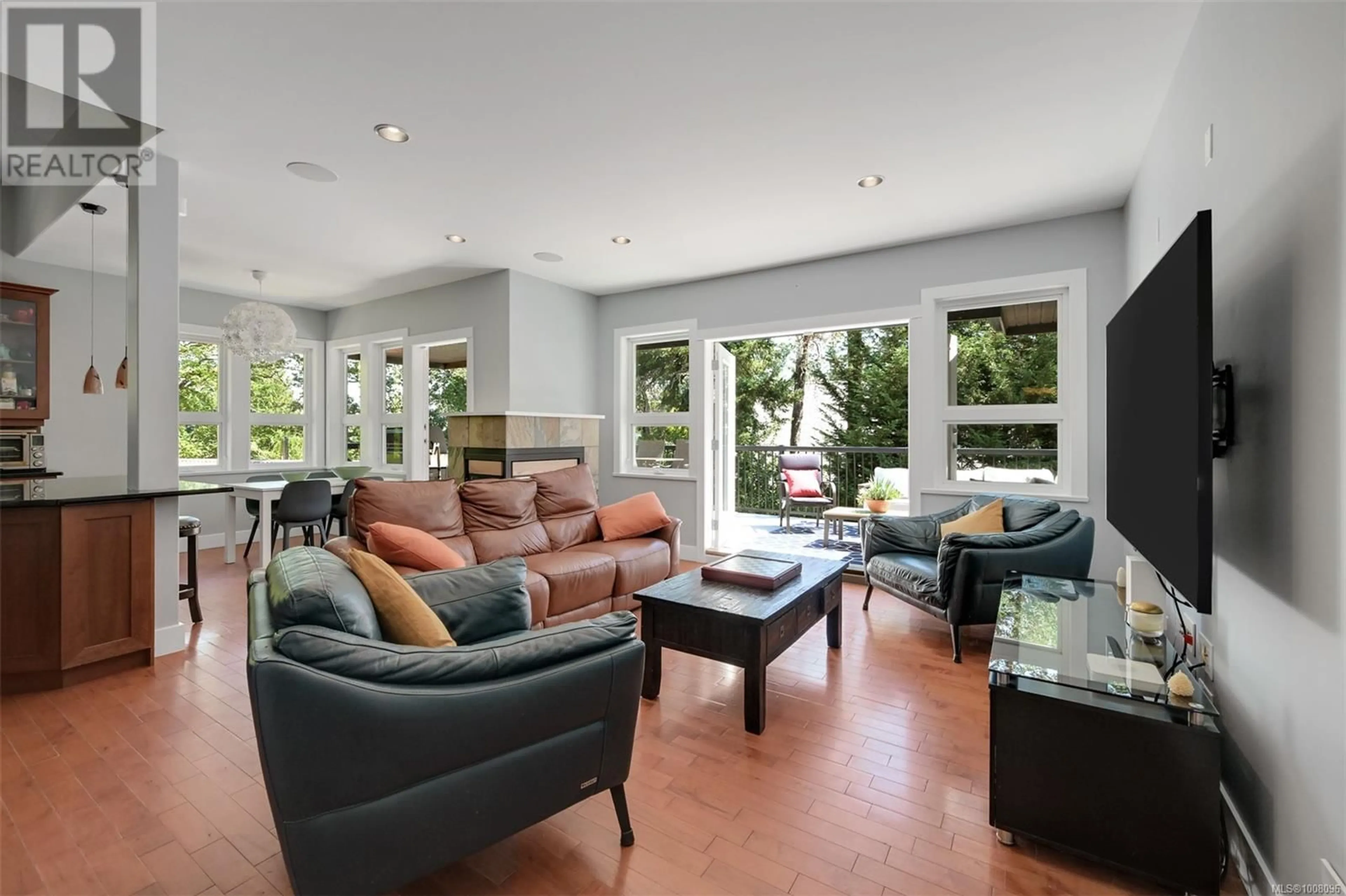 Living room with furniture, ceramic/tile floor for 6799 JEDORA DRIVE, Central Saanich British Columbia V8M1A6