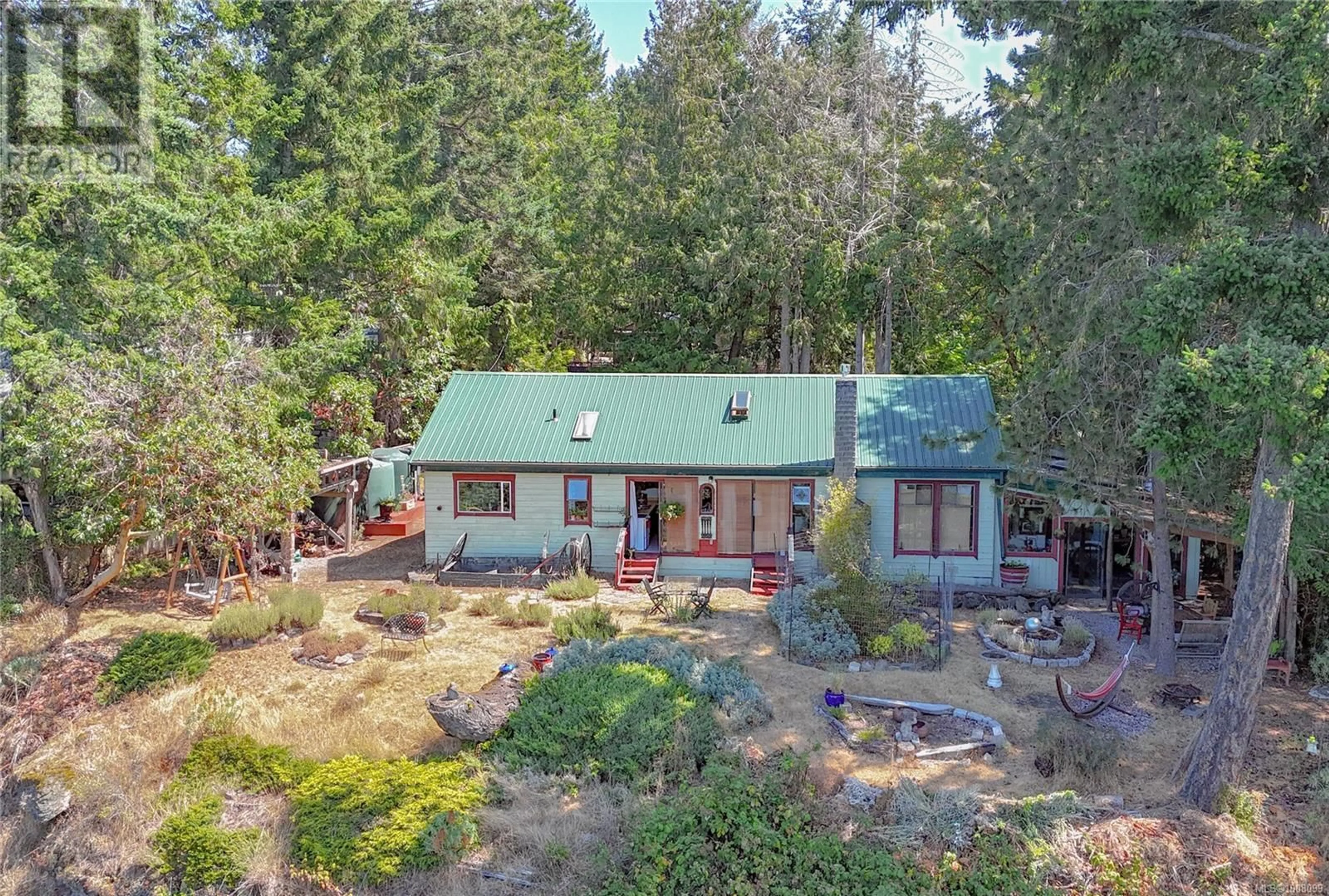 A pic from outside/outdoor area/front of a property/back of a property/a pic from drone, forest/trees view for 1025 PAT BURNS AVENUE, Gabriola Island British Columbia V0R1X2