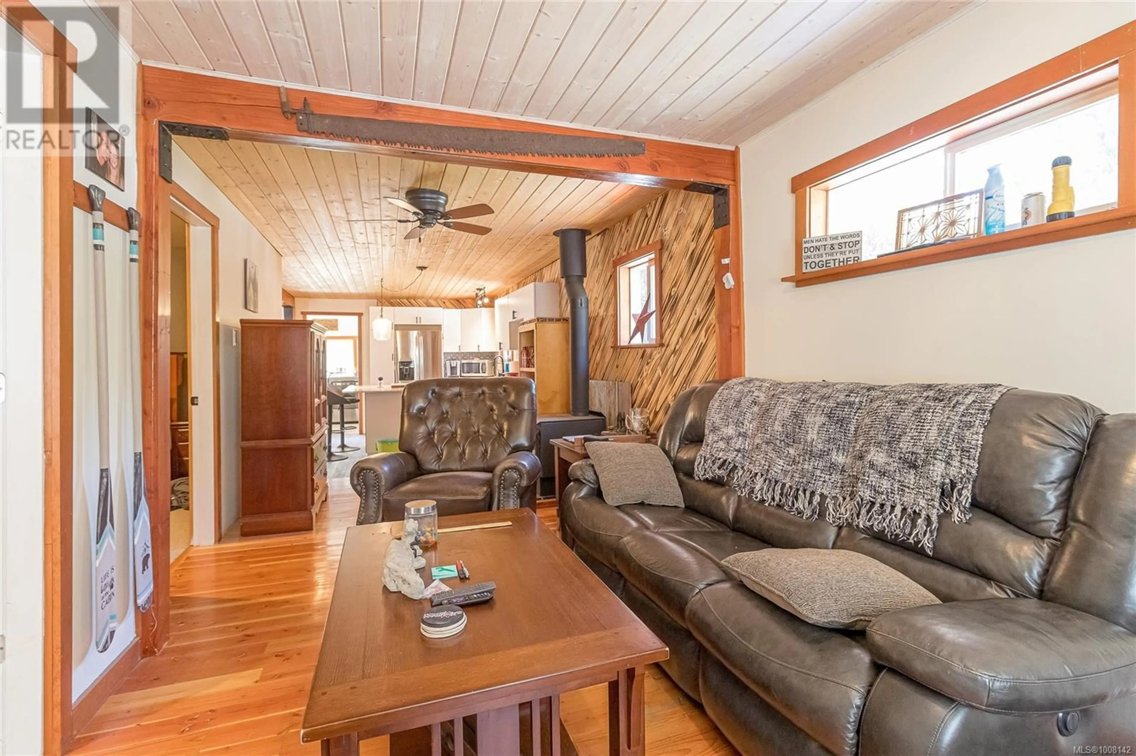 Living room with furniture, wood/laminate floor for 7420 COWICHAN LAKE ROAD, Lake Cowichan British Columbia V0R2G0