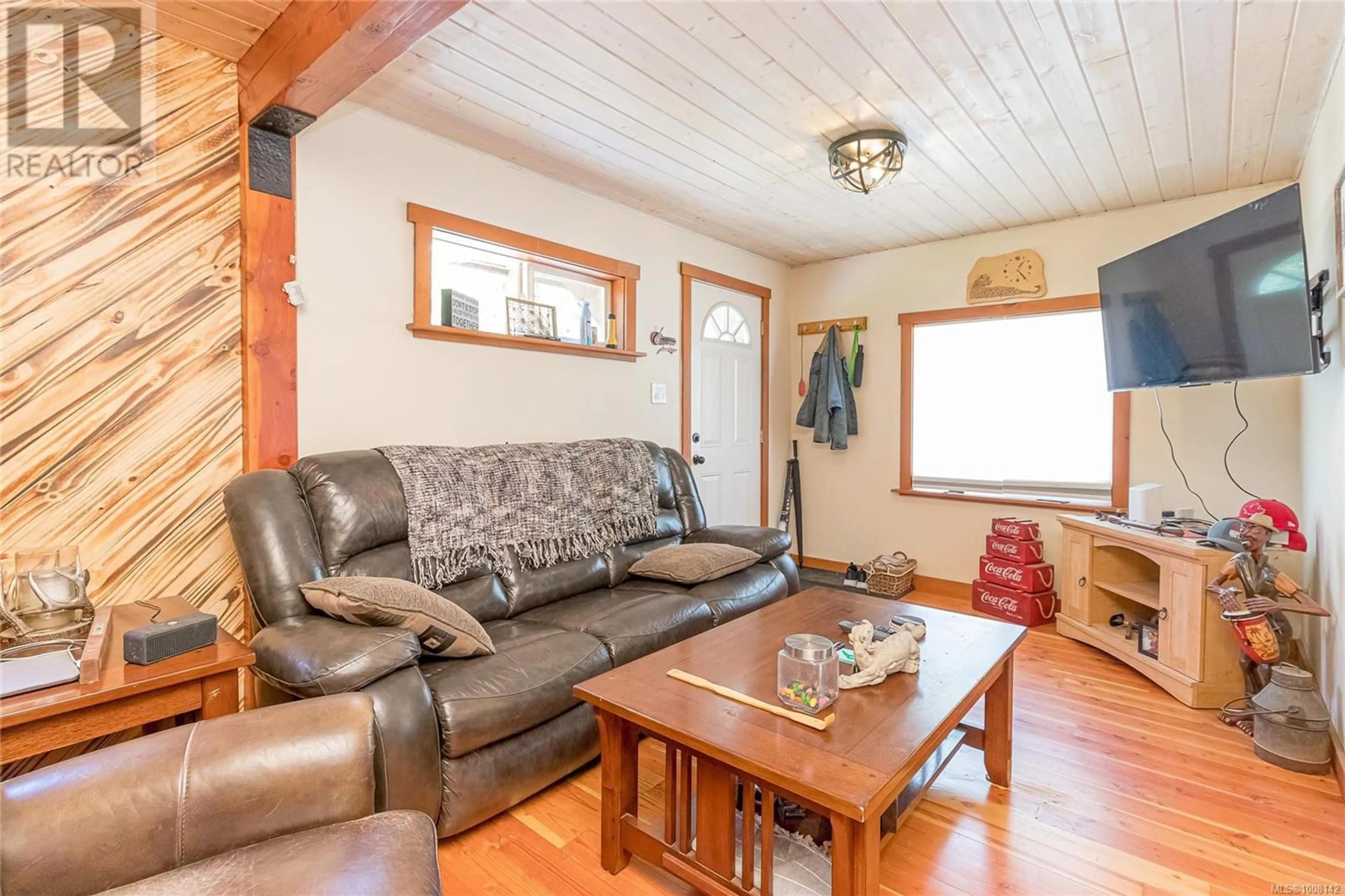 Living room with furniture, wood/laminate floor for 7420 COWICHAN LAKE ROAD, Lake Cowichan British Columbia V0R2G0