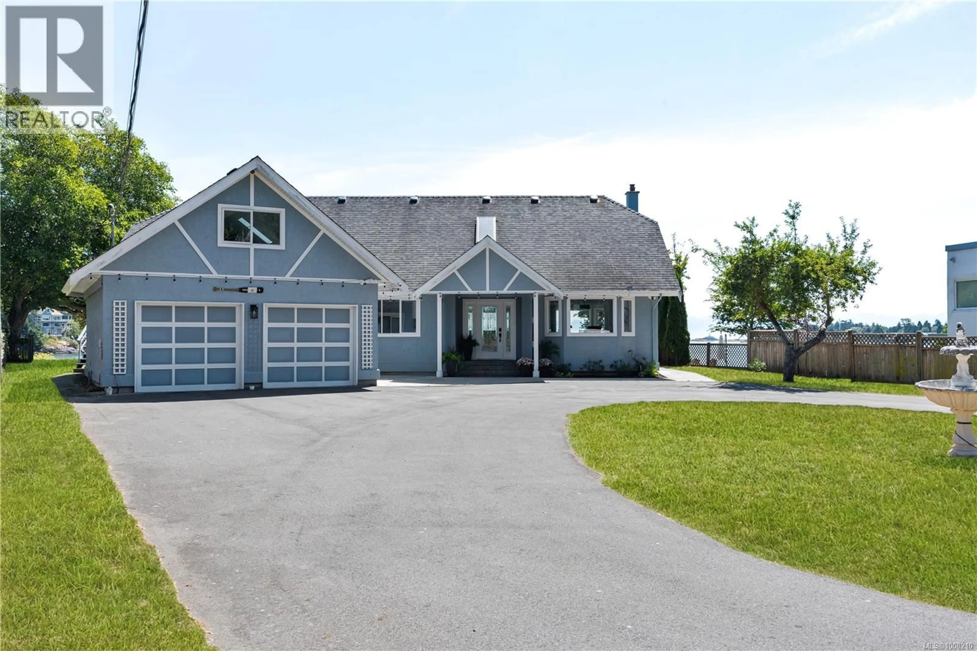 Home with vinyl exterior material, street for 3905B CADBORO BAY ROAD, Saanich British Columbia V8N4G3