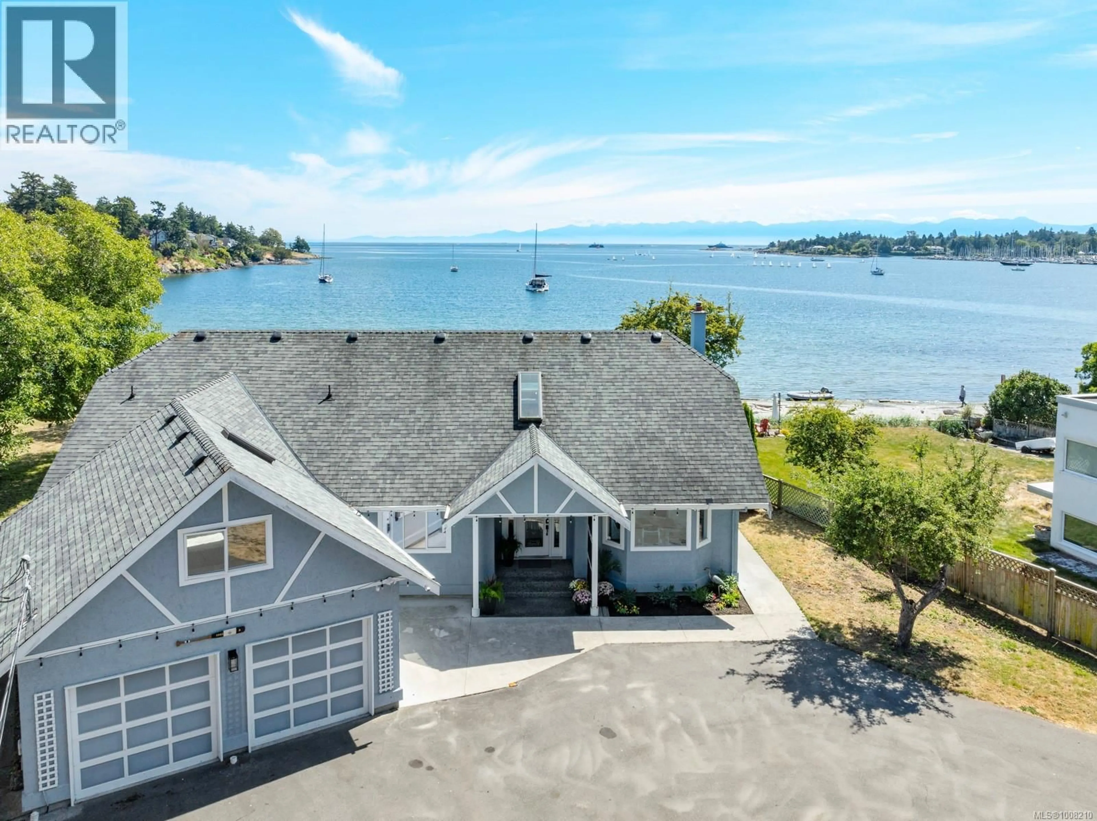A pic from outside/outdoor area/front of a property/back of a property/a pic from drone, water/lake/river/ocean view for 3905B CADBORO BAY ROAD, Saanich British Columbia V8N4G3