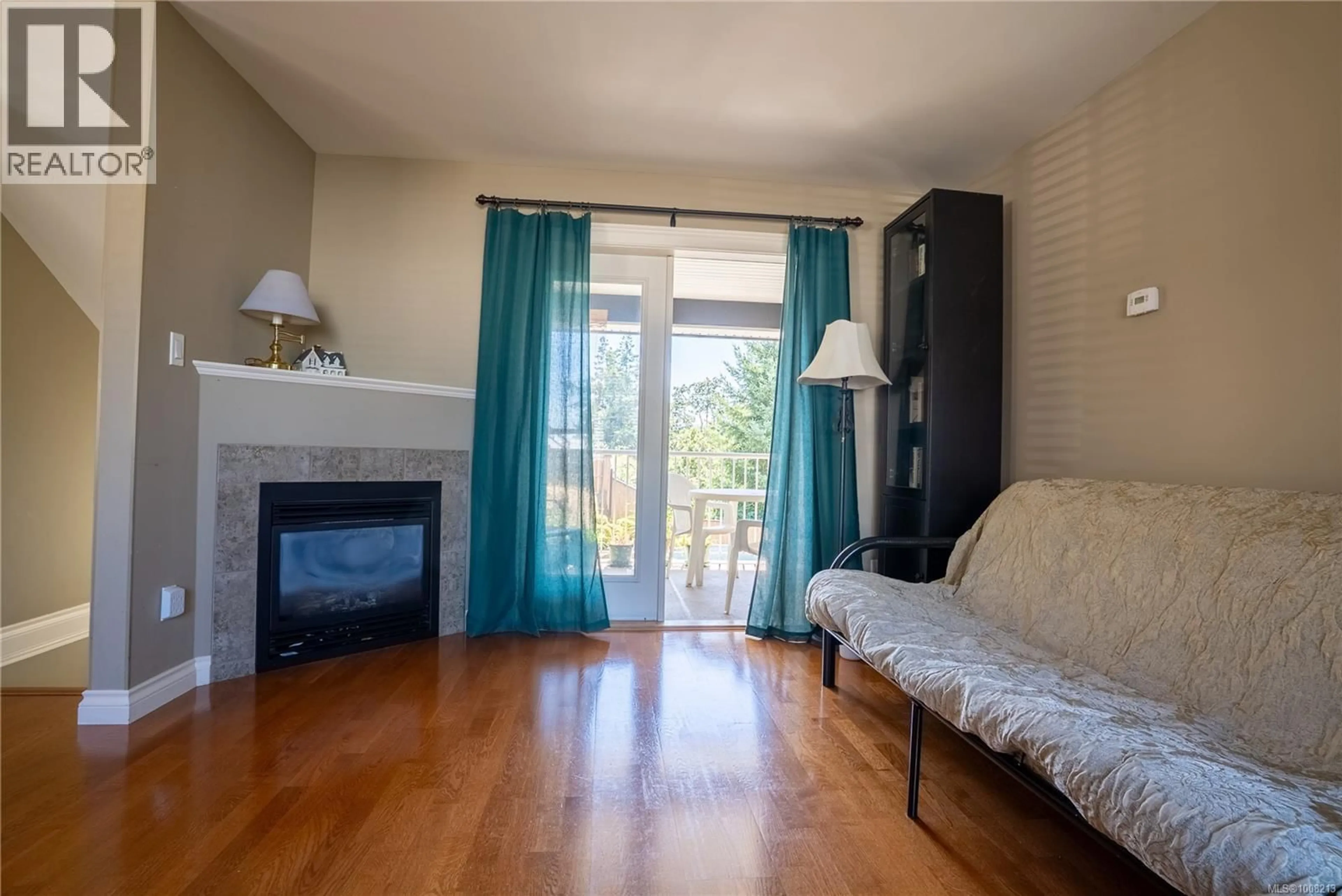 Living room with furniture, wood/laminate floor for 104 - 2678 WINSTER ROAD, Langford British Columbia V9B3R8