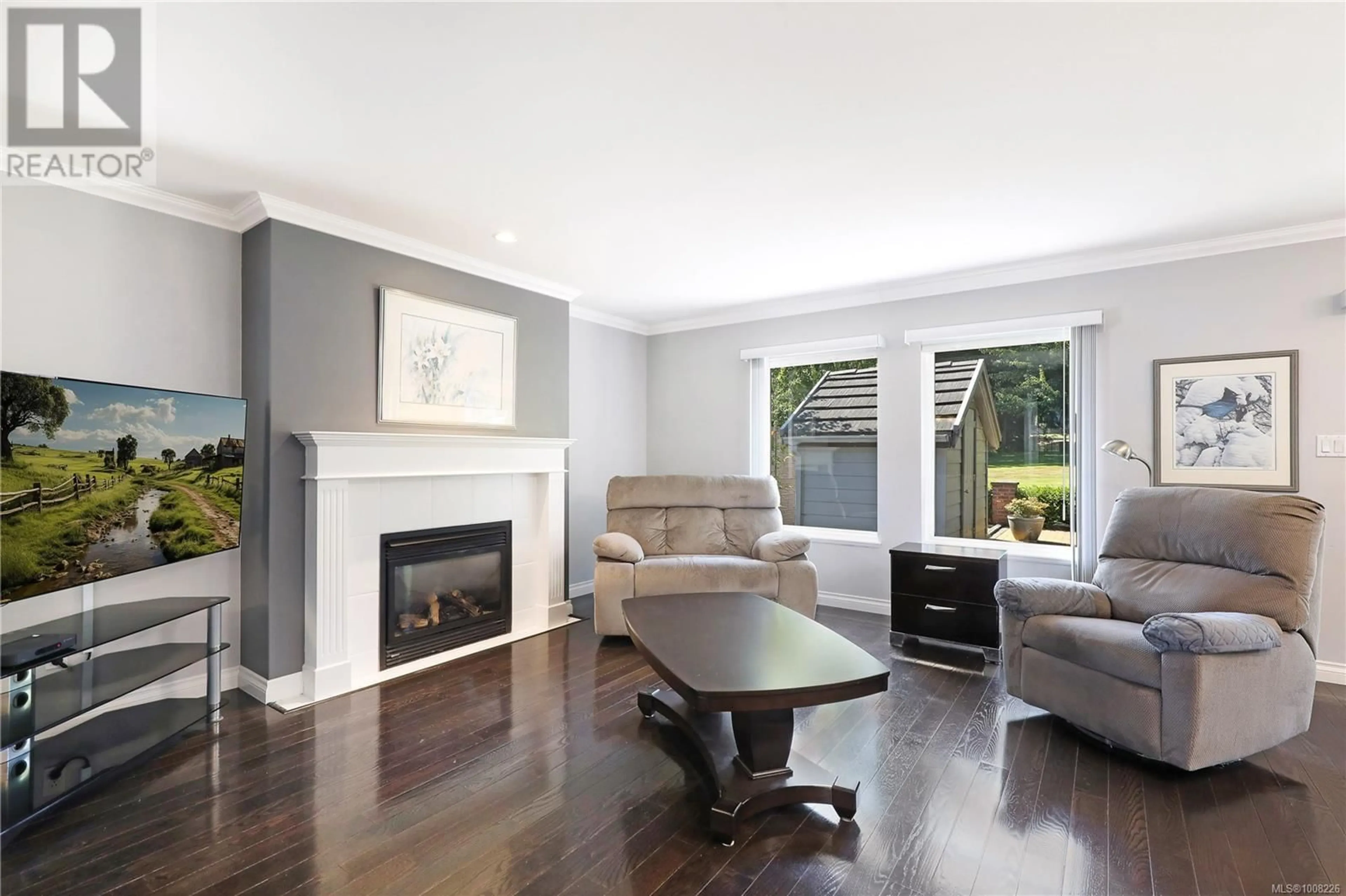 Living room with furniture, wood/laminate floor for 2371 IDIENS WAY, Courtenay British Columbia V9N9H5