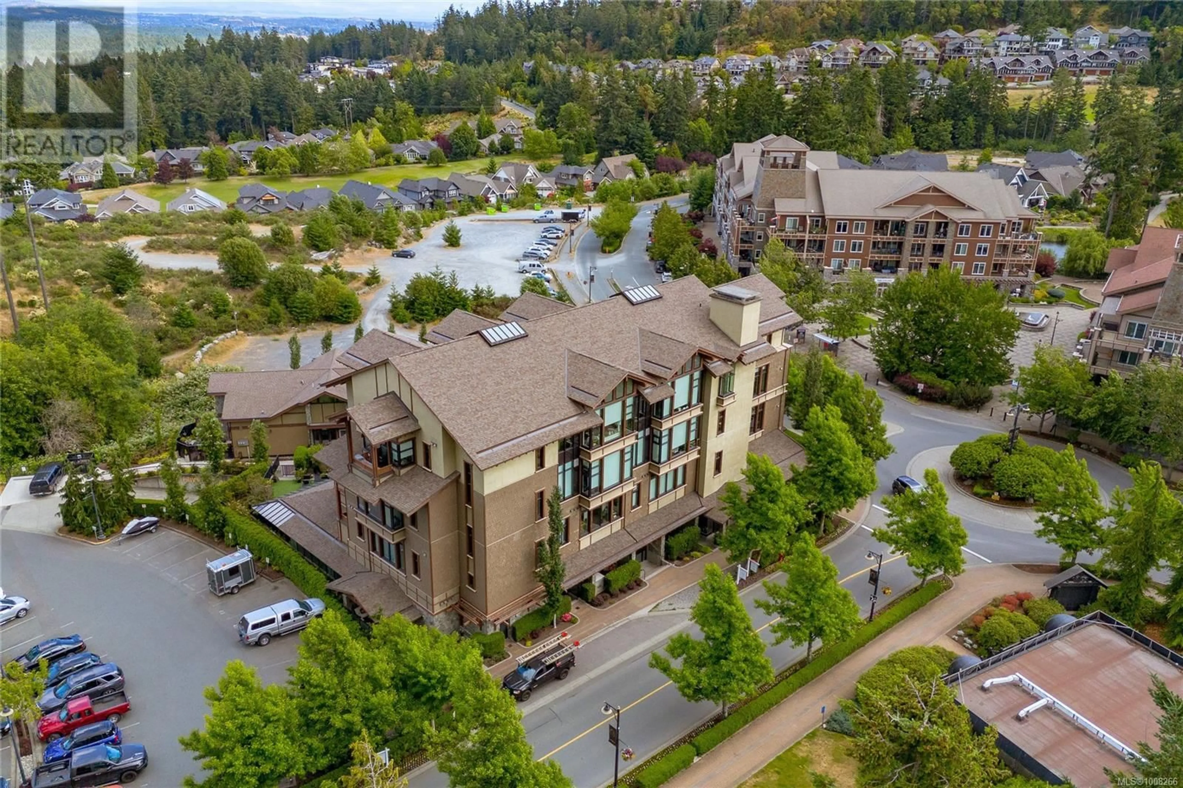 A pic from outside/outdoor area/front of a property/back of a property/a pic from drone, water/lake/river/ocean view for 106 - 2049 COUNTRY CLUB WAY, Langford British Columbia V9B0H8