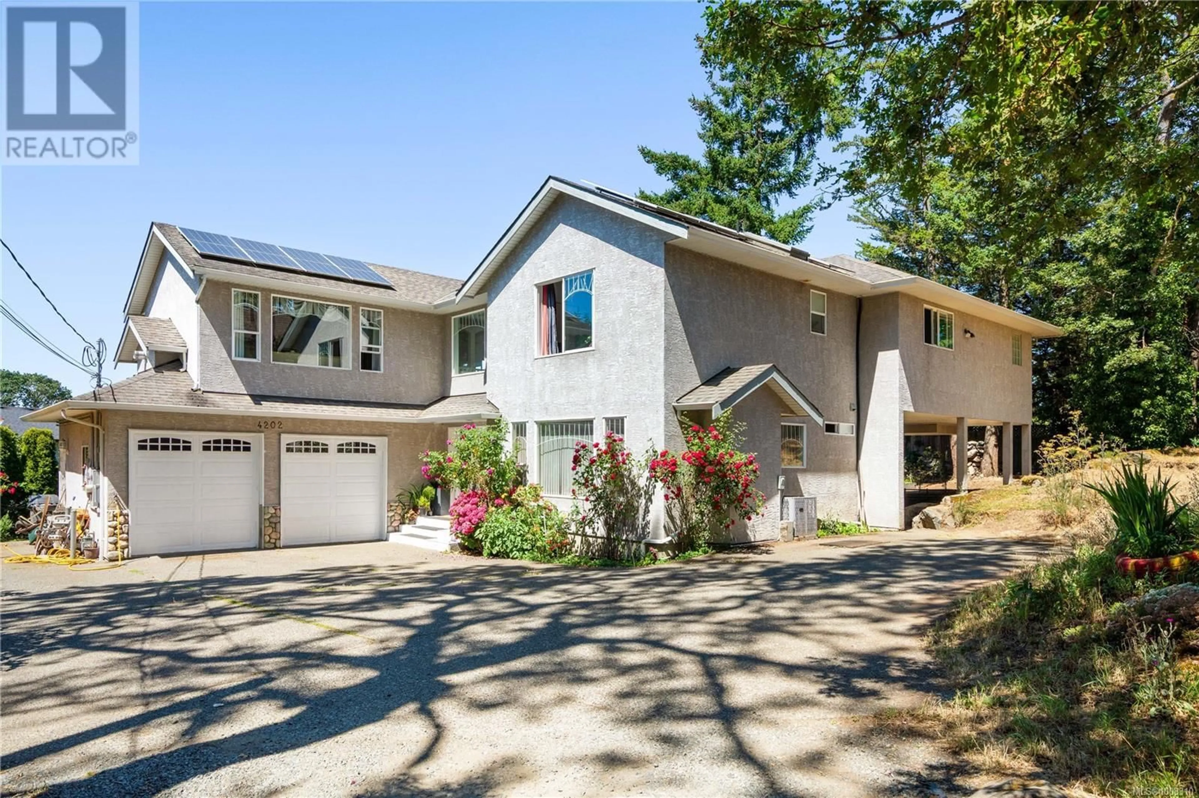 Home with vinyl exterior material, street for 4202 QUADRA STREET, Saanich British Columbia V8X1L4