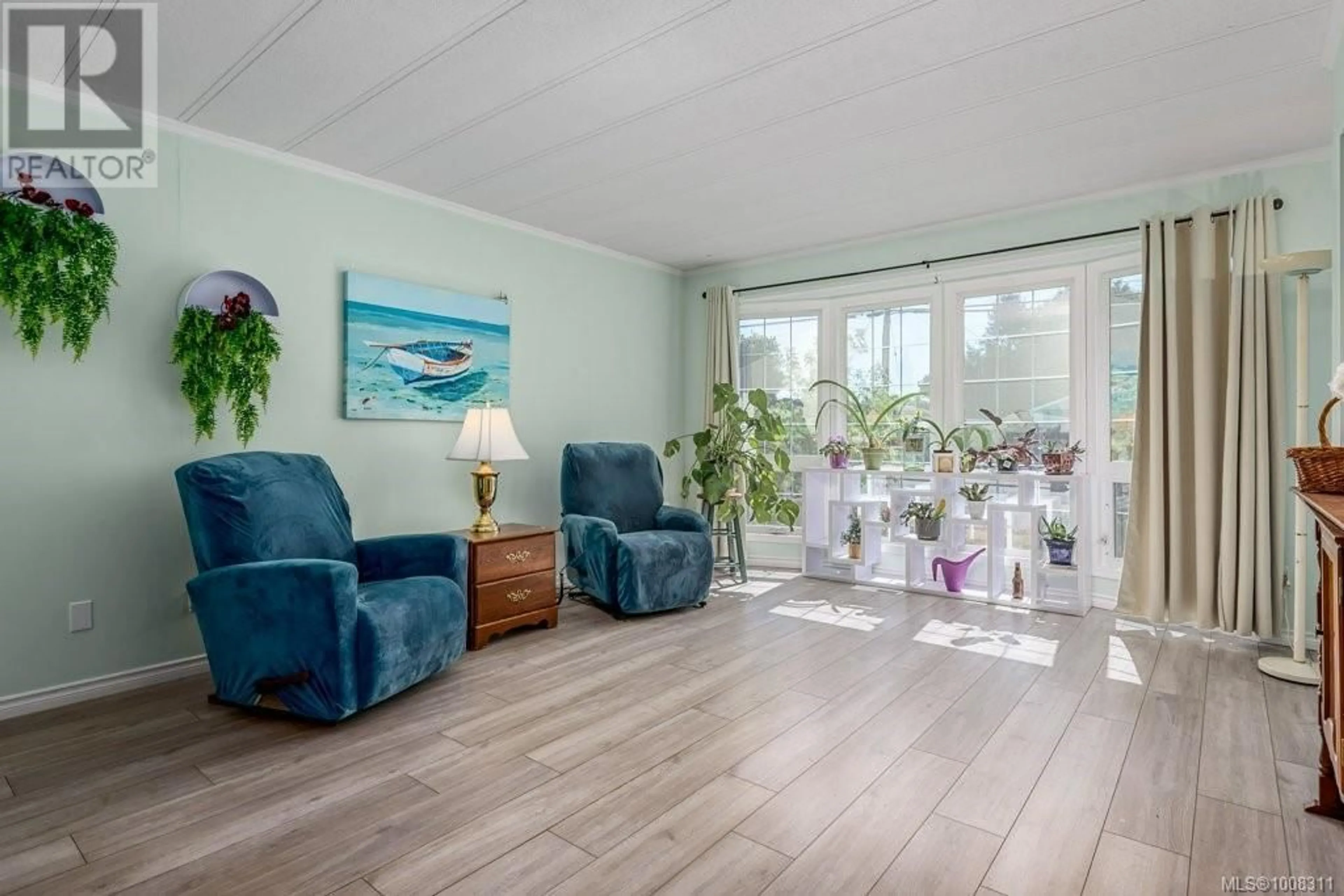 Living room with furniture, wood/laminate floor for 2340 6TH STREET EAST, Courtenay British Columbia V9N7R9