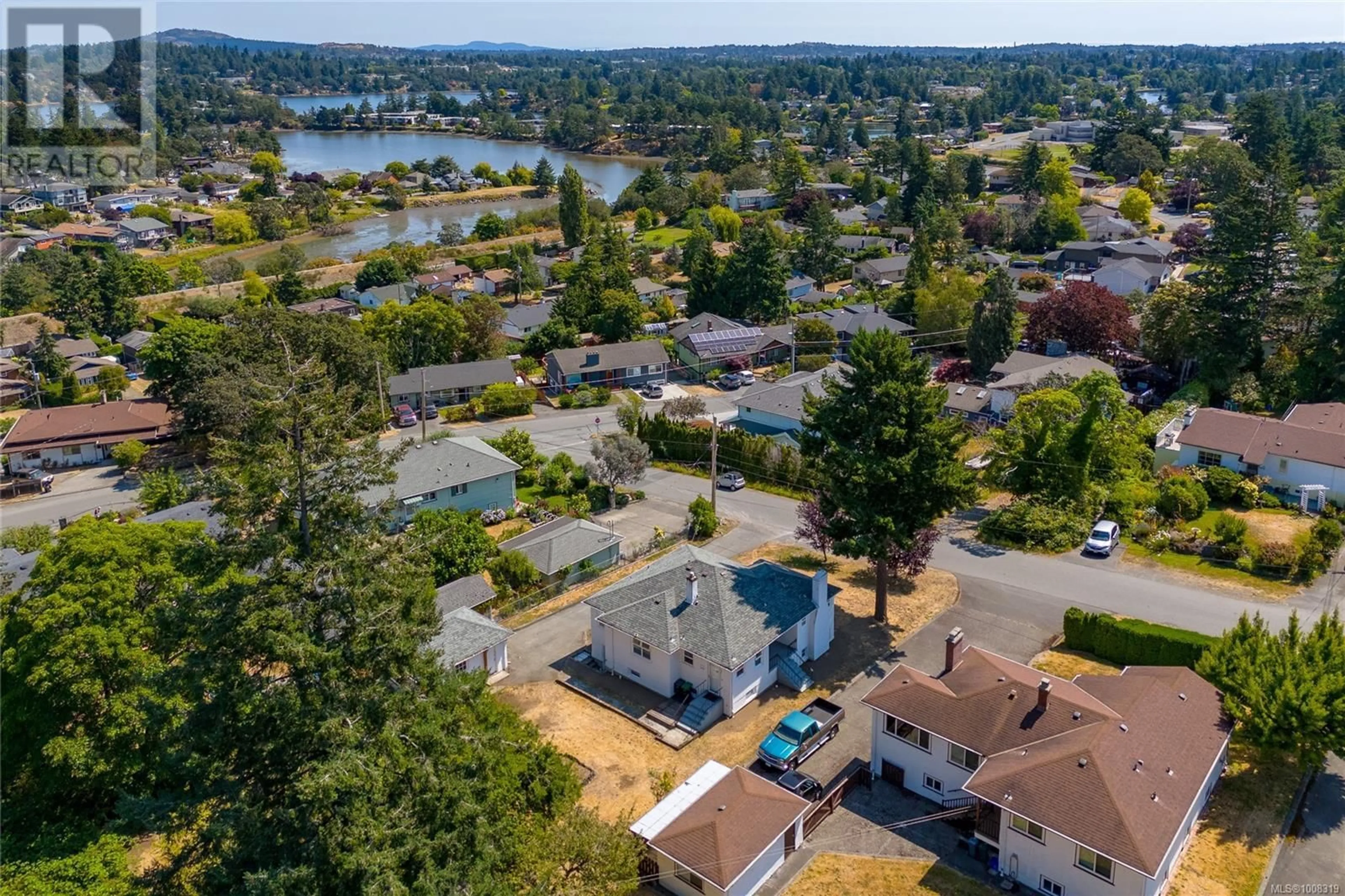 A pic from outside/outdoor area/front of a property/back of a property/a pic from drone, water/lake/river/ocean view for 210 SUZANNE PLACE, View Royal British Columbia V9B1P1