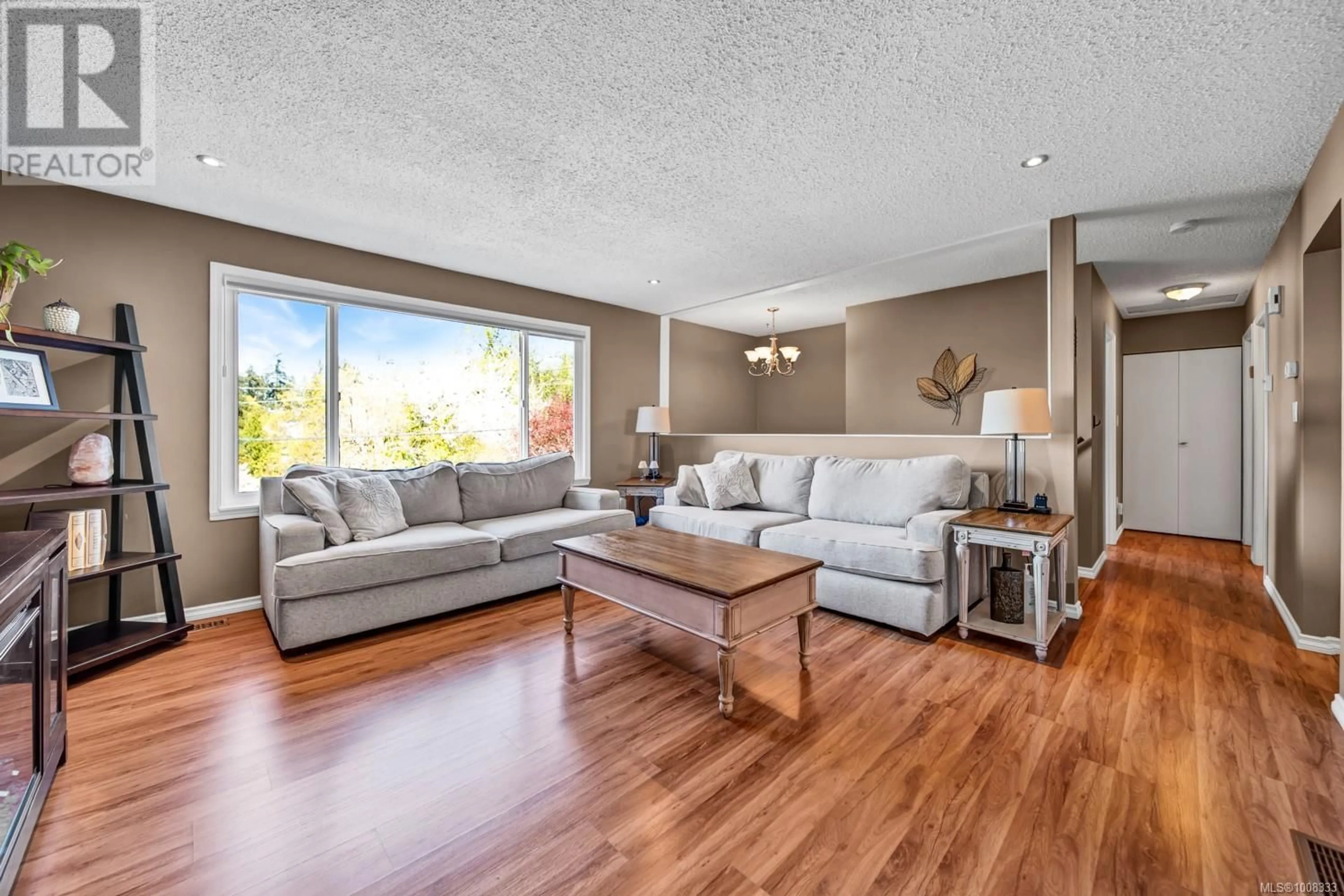 Living room with furniture, wood/laminate floor for 1208 CLOKE ROAD, Ladysmith British Columbia V9G1P8