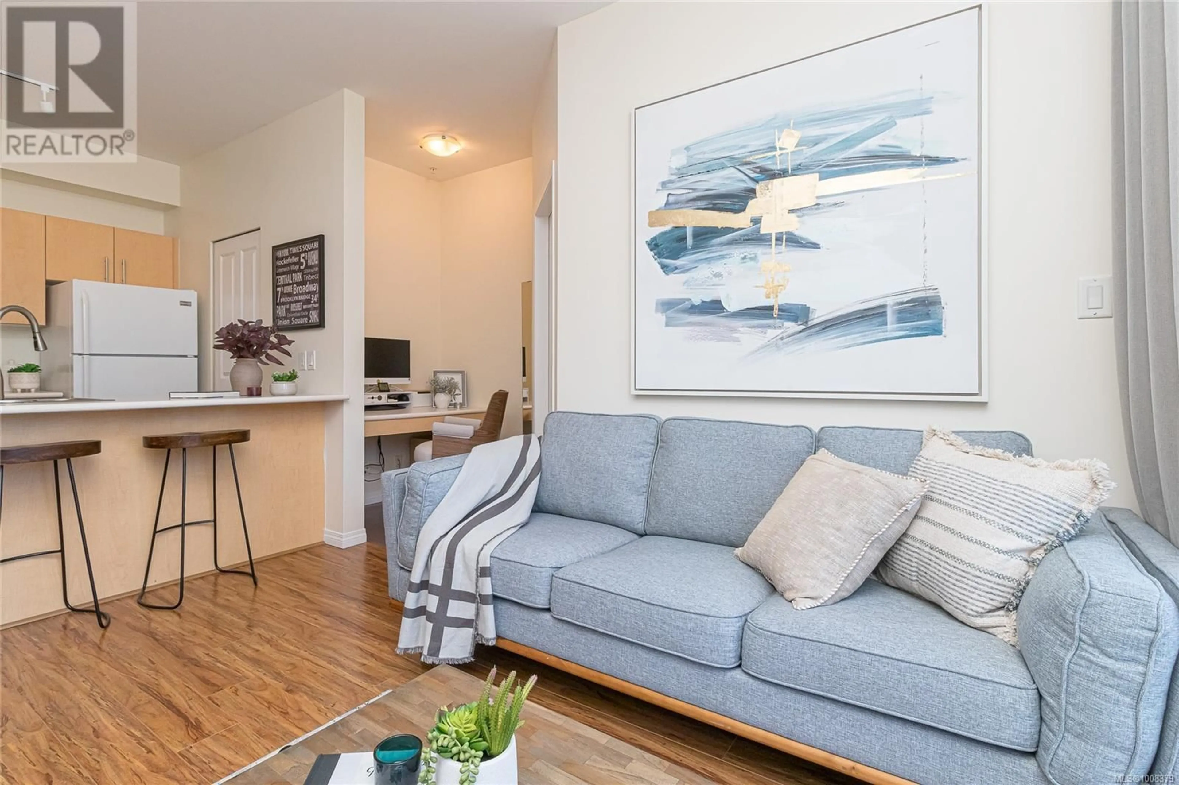 Living room with furniture, wood/laminate floor for 315 - 1550 CHURCH AVENUE, Saanich British Columbia V8P2H1