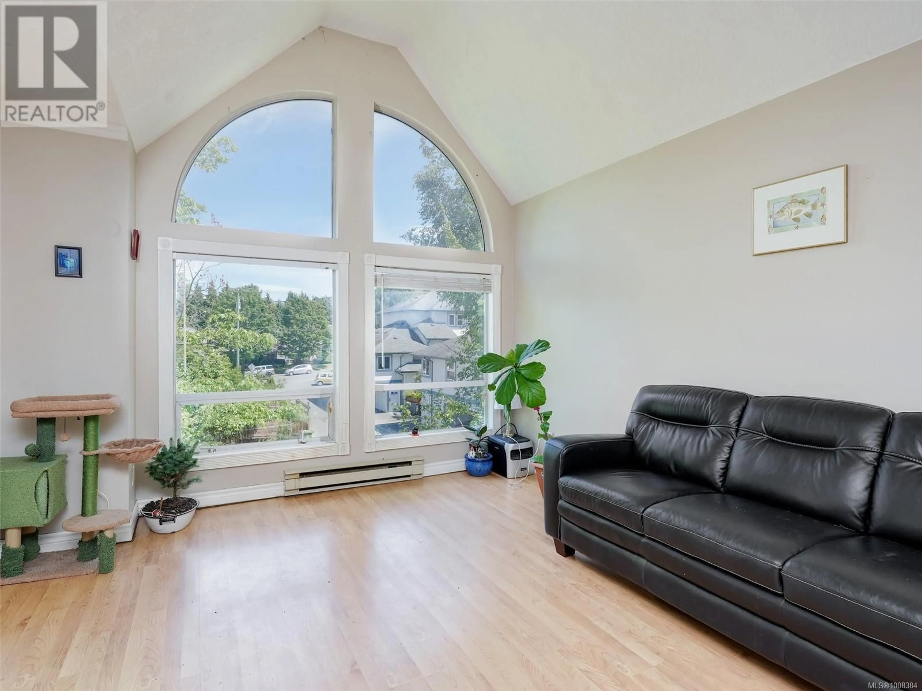 Living room with furniture, wood/laminate floor for 302 - 3263 ALDER STREET, Saanich British Columbia V8X1P3