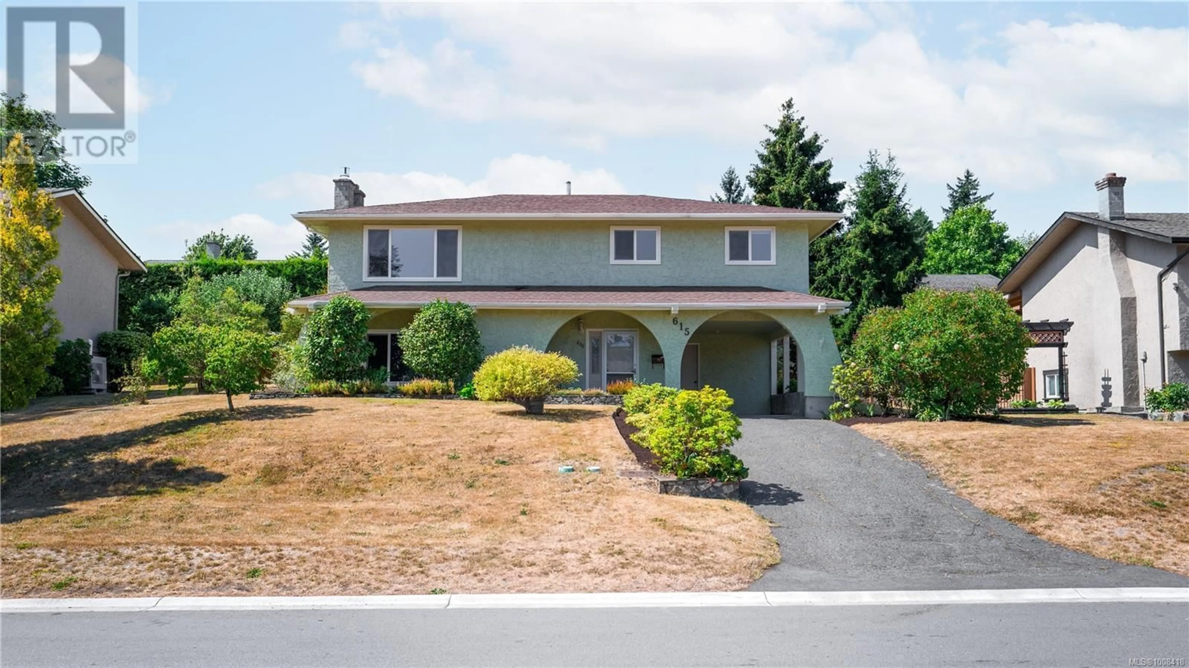 Home with vinyl exterior material, street for 615 VANALMAN AVENUE, Saanich British Columbia V8Z3A8