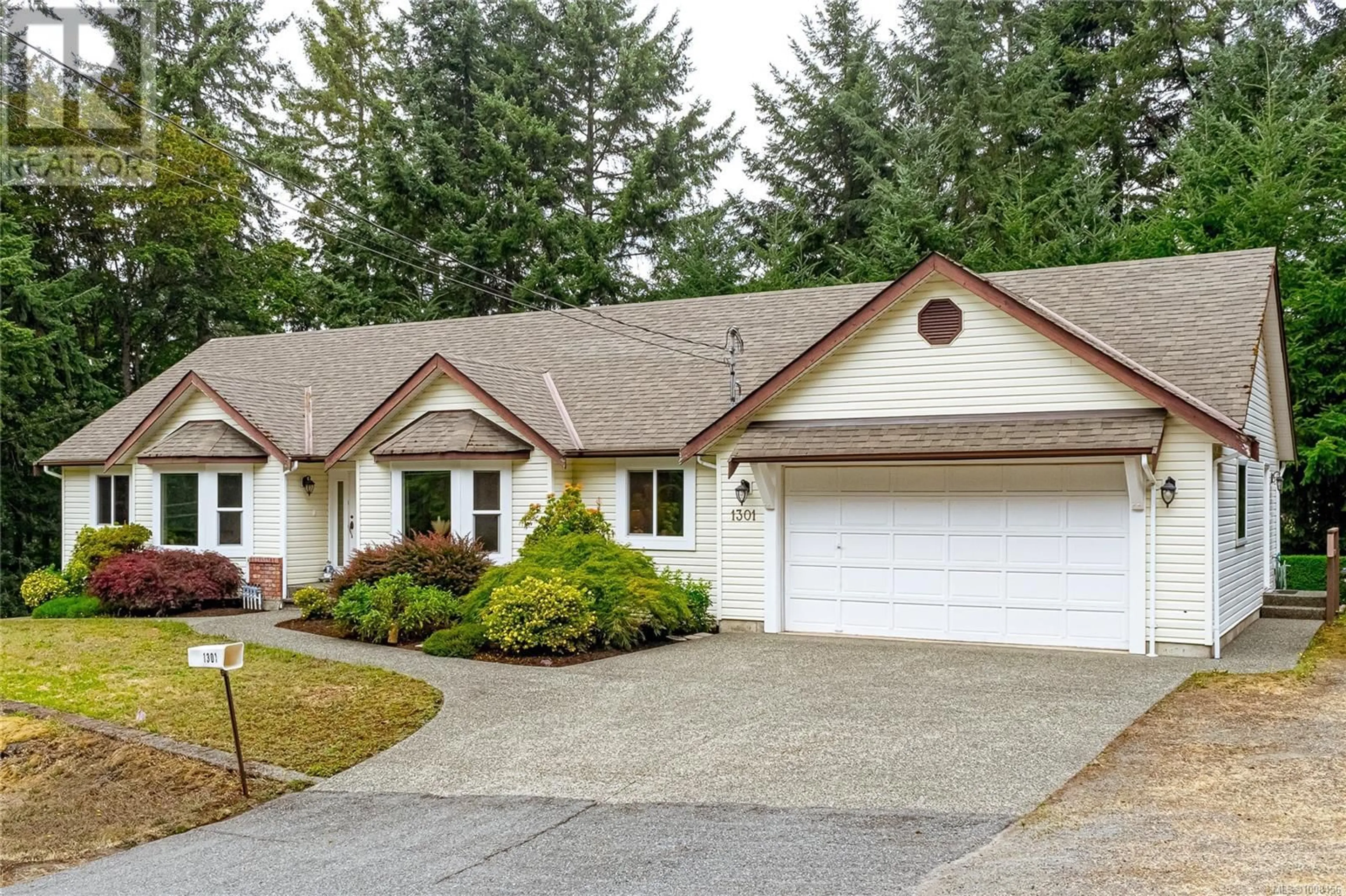 Home with vinyl exterior material, street for 1301 MCKENZIE DRIVE, Duncan British Columbia V9L5R9