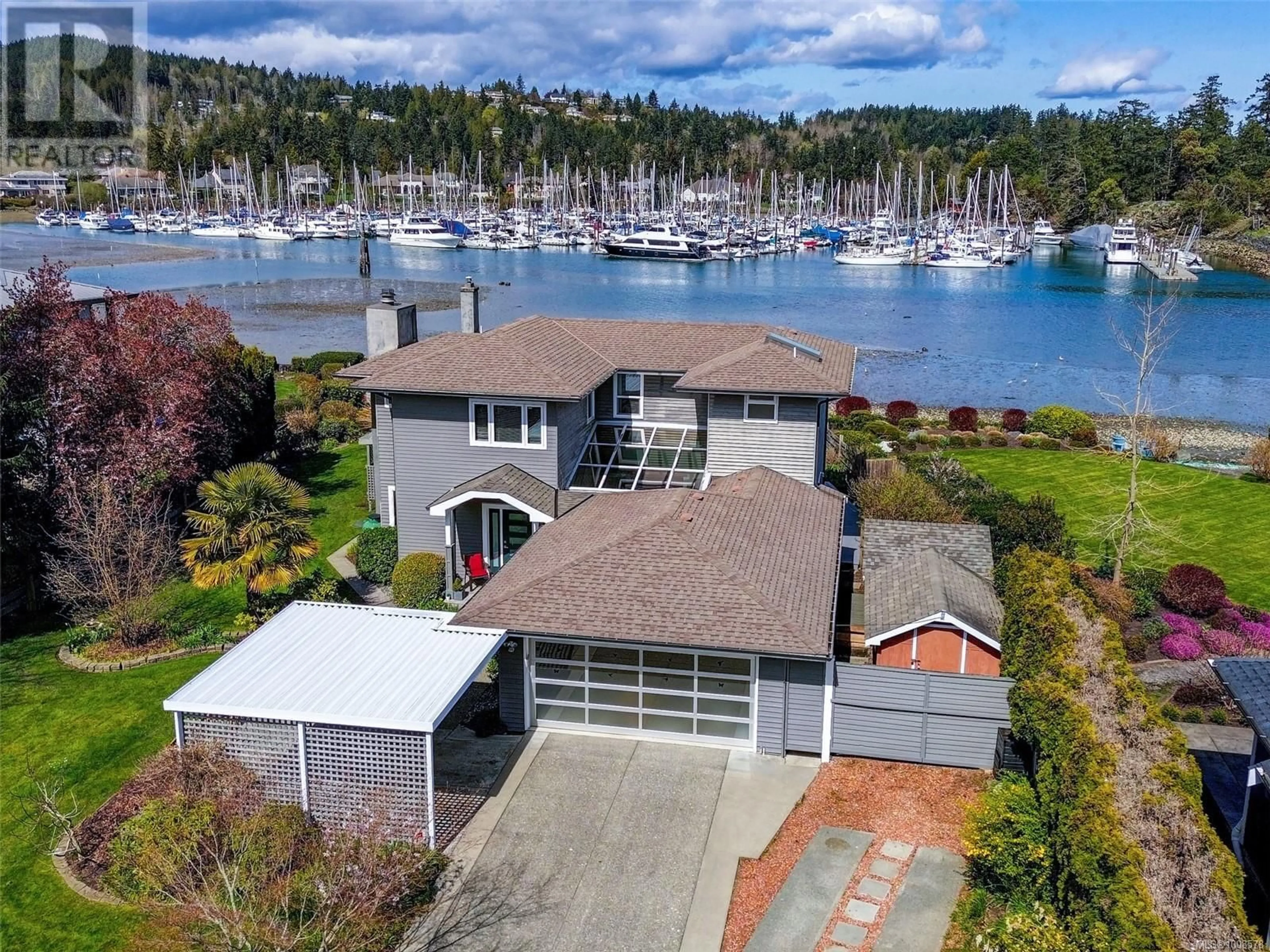 A pic from outside/outdoor area/front of a property/back of a property/a pic from drone, water/lake/river/ocean view for 10680 BLUE HERON ROAD, North Saanich British Columbia V8L3X9