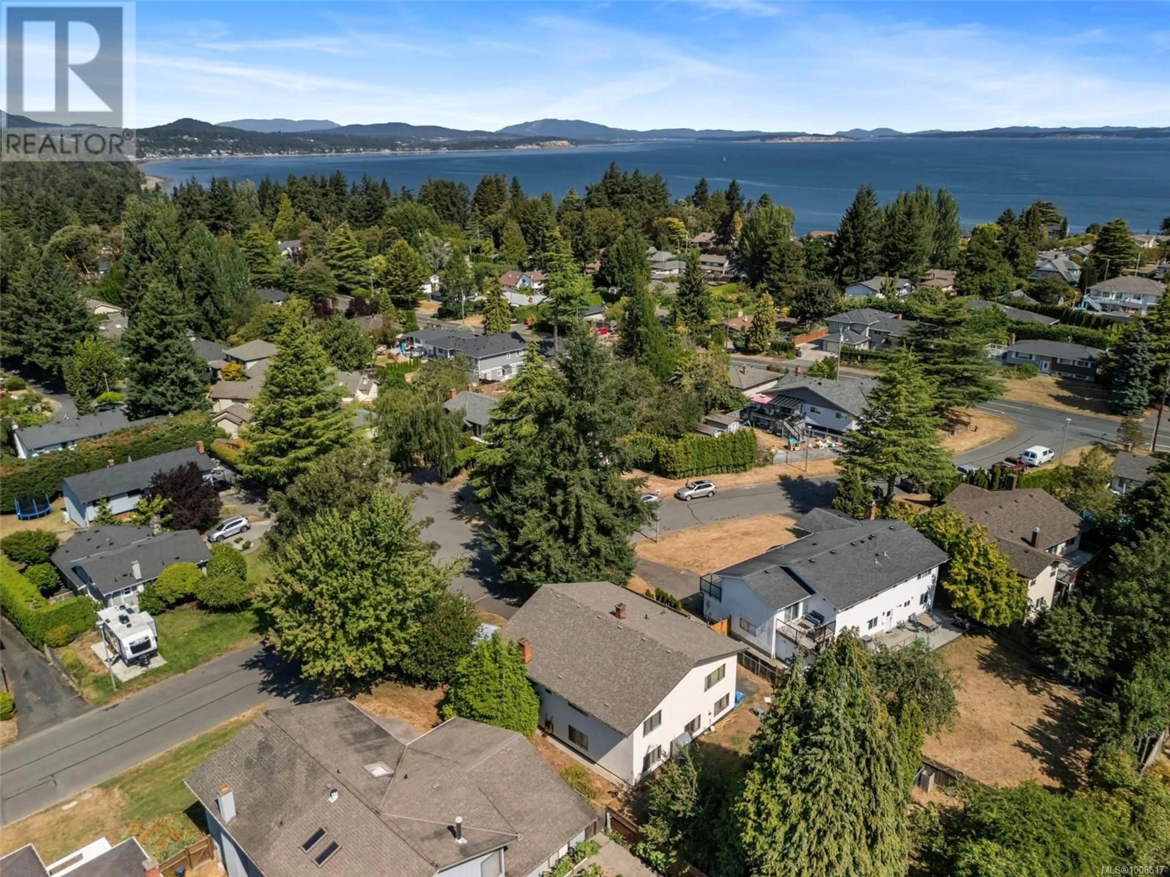 A pic from outside/outdoor area/front of a property/back of a property/a pic from drone, water/lake/river/ocean view for 4461 TREMBLAY DRIVE, Saanich British Columbia V8N4W7