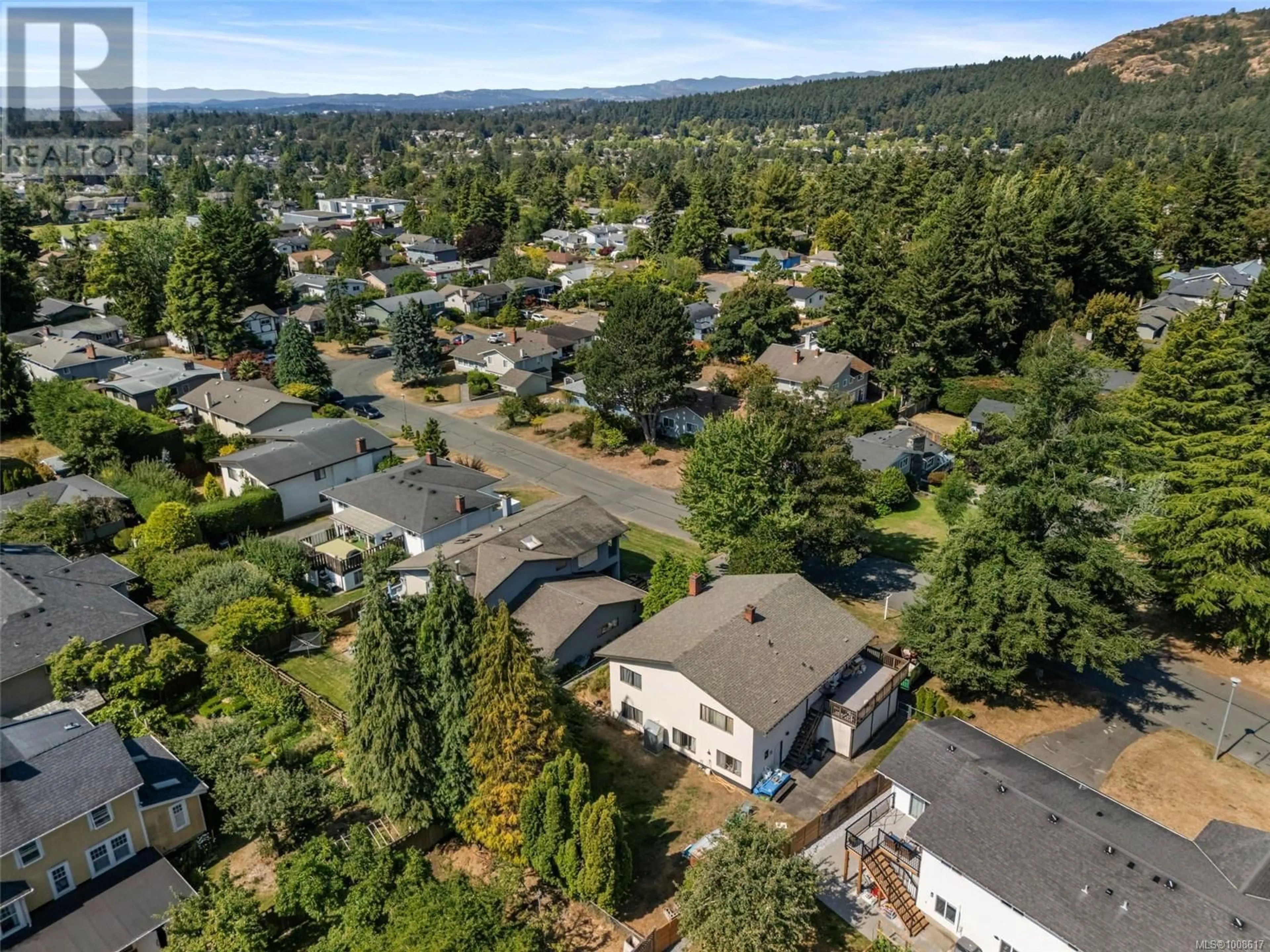A pic from outside/outdoor area/front of a property/back of a property/a pic from drone, mountain view for 4461 TREMBLAY DRIVE, Saanich British Columbia V8N4W7