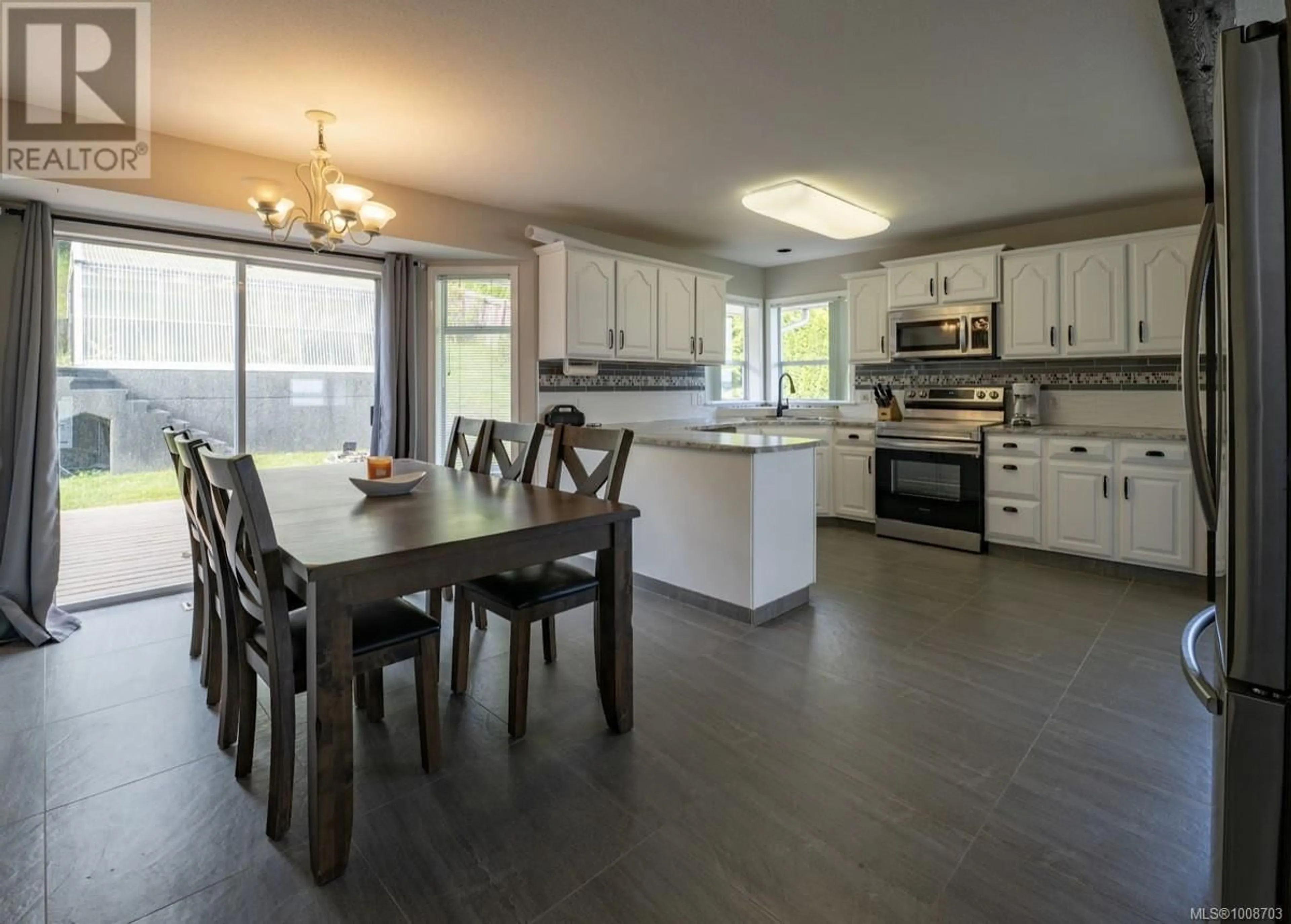 Open concept kitchen, wood/laminate floor for 2543 CARDENA CRESCENT, Port McNeill British Columbia V0N2R0