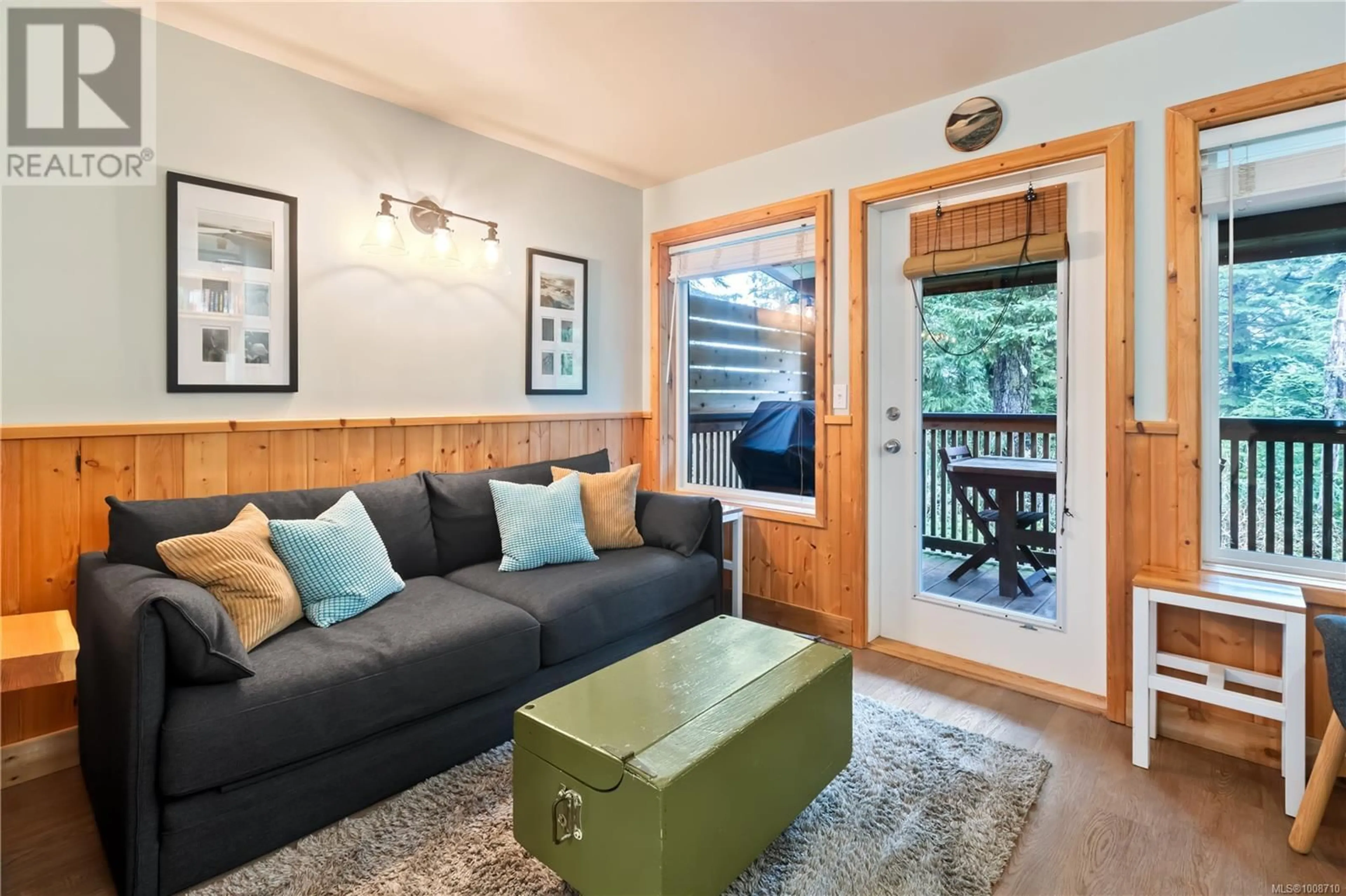 Living room with furniture, wood/laminate floor for 26 - 1051 TYEE TERRACE, Ucluelet British Columbia V0R3A0