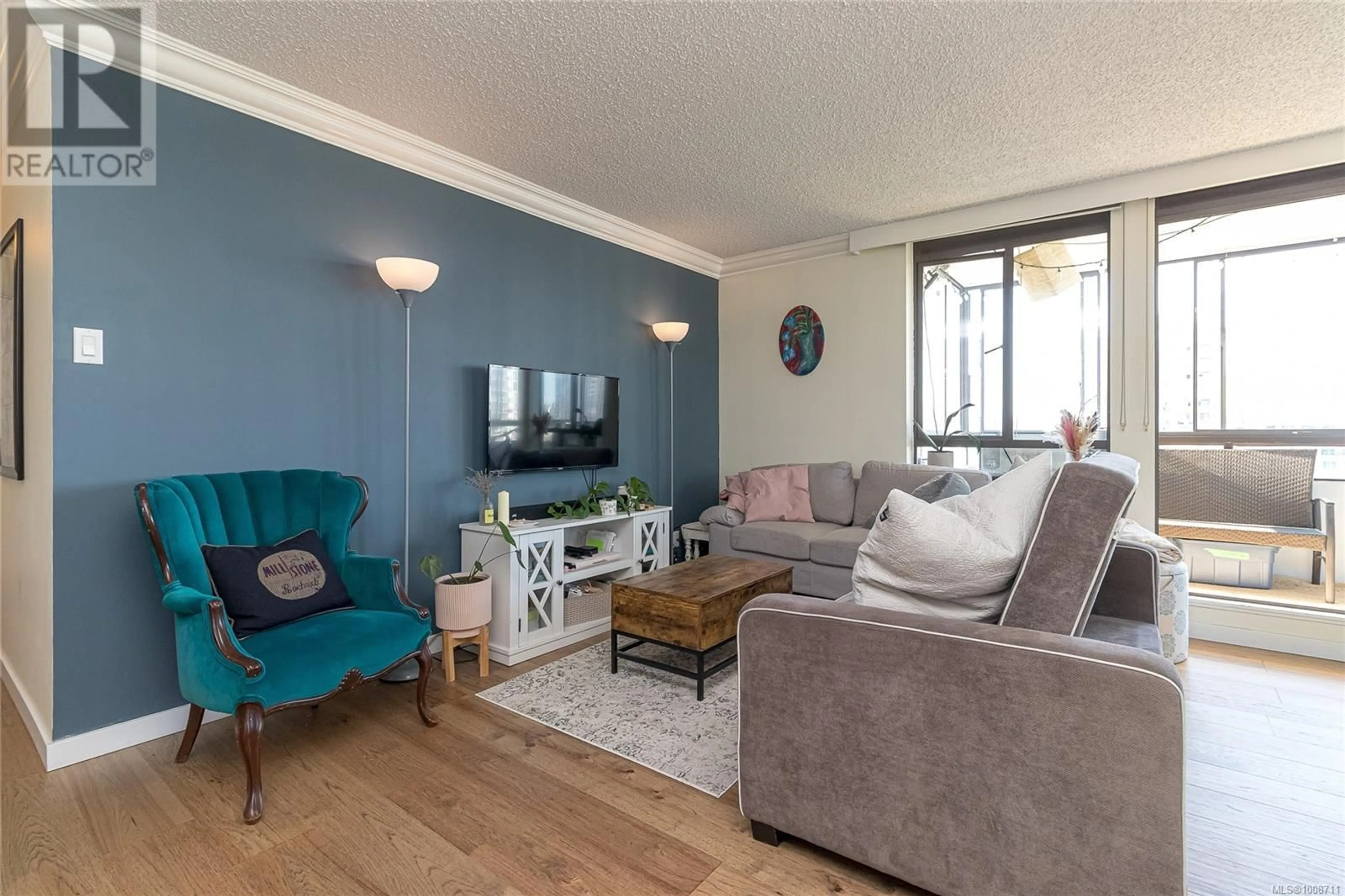 Living room with furniture, wood/laminate floor for 804 - 1026 JOHNSON STREET, Victoria British Columbia V8V3N7