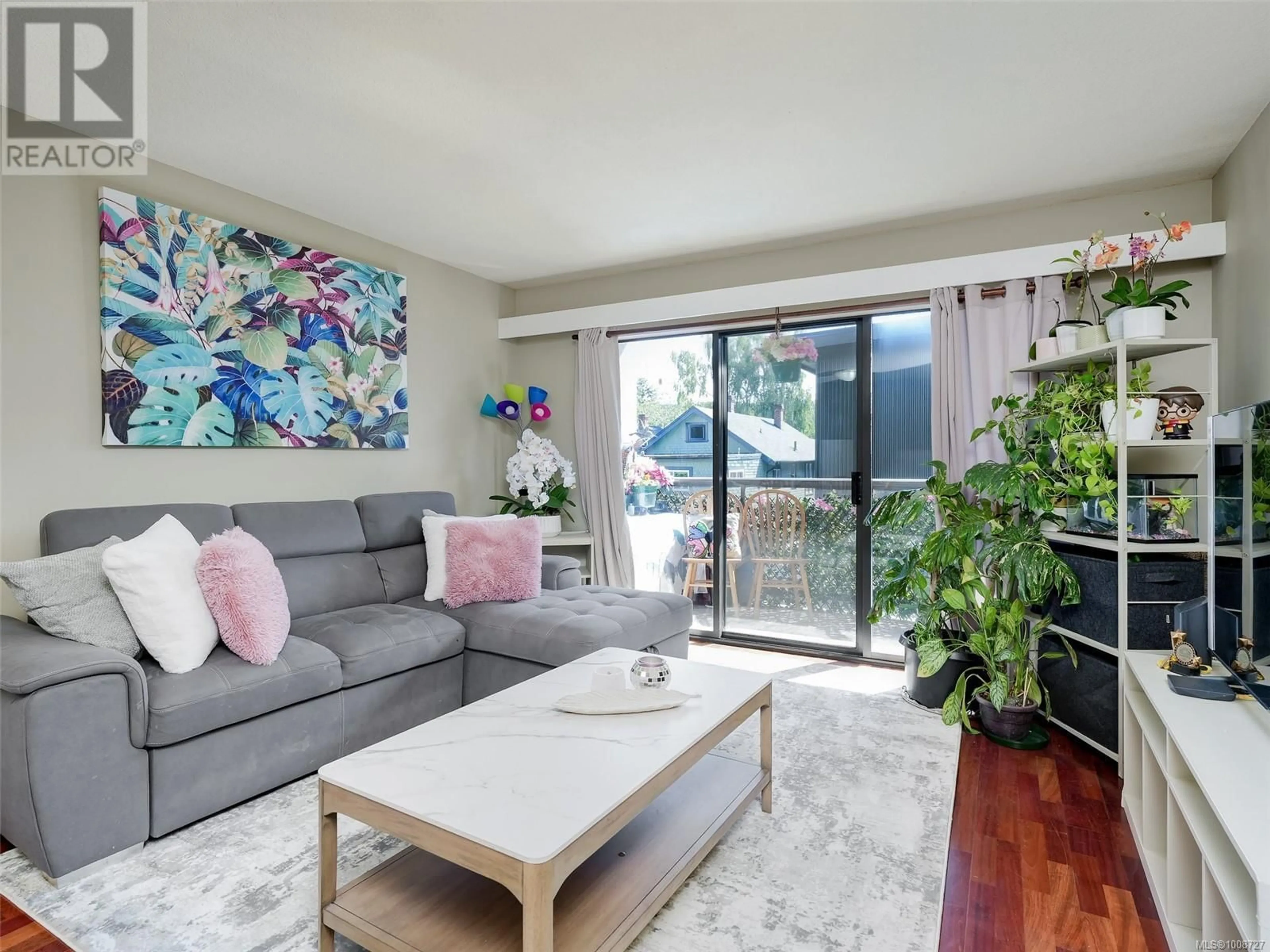 Living room with furniture, wood/laminate floor for 203 - 2747 QUADRA STREET, Victoria British Columbia V8T4E5