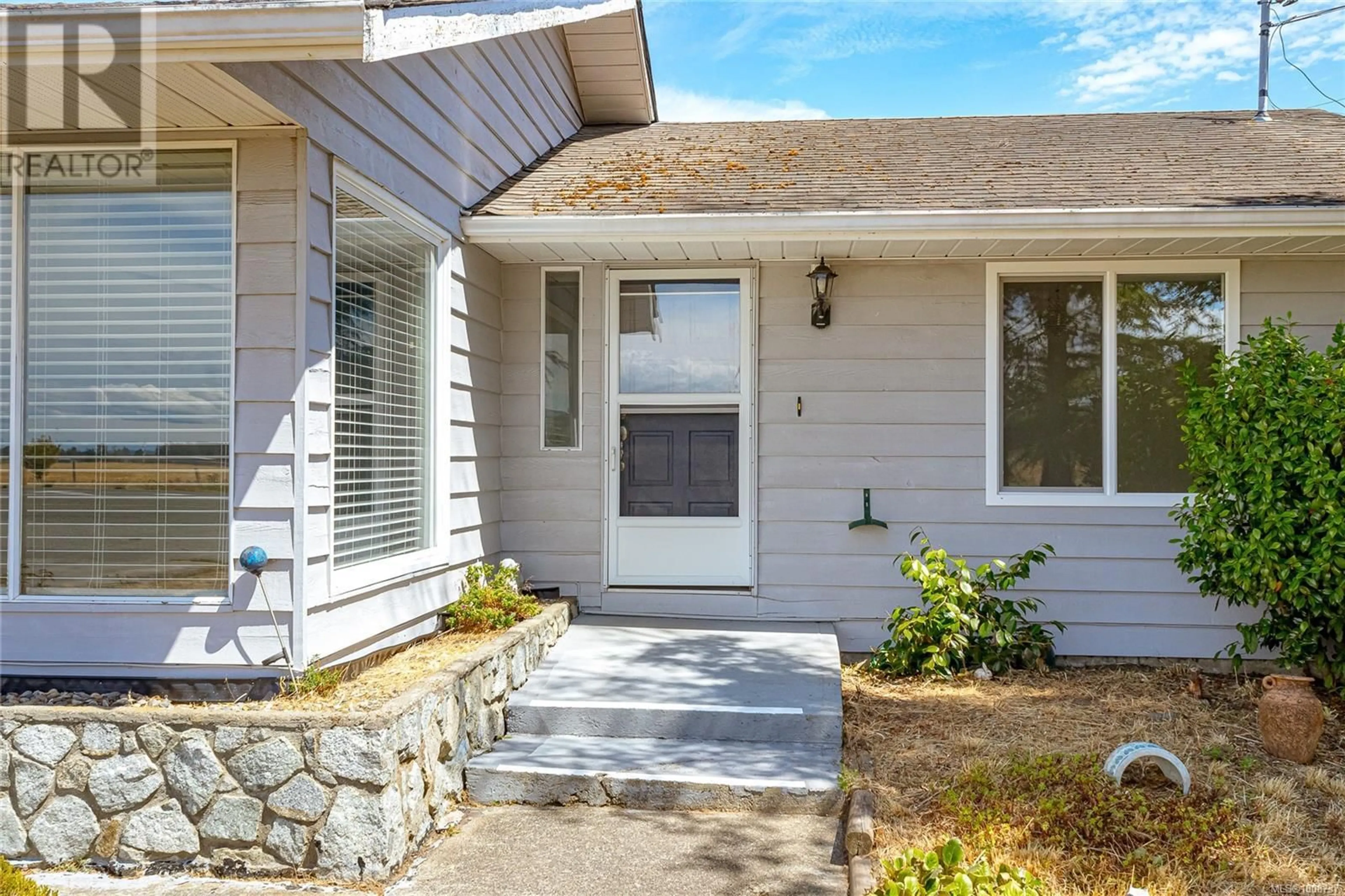 Home with vinyl exterior material, street for 9445 CANORA ROAD, Sidney British Columbia V8L1P3