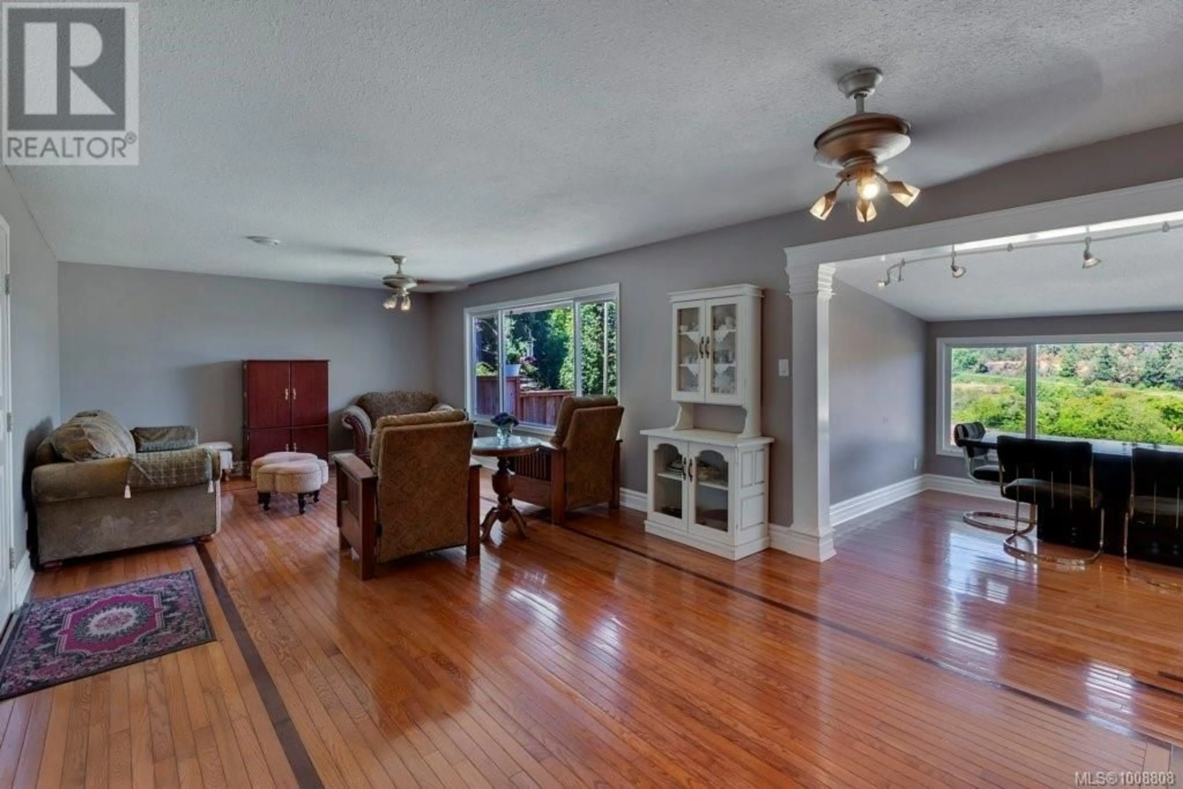 Living room with furniture, wood/laminate floor for 2028 CATHERS DRIVE, Nanaimo British Columbia V9R6R9