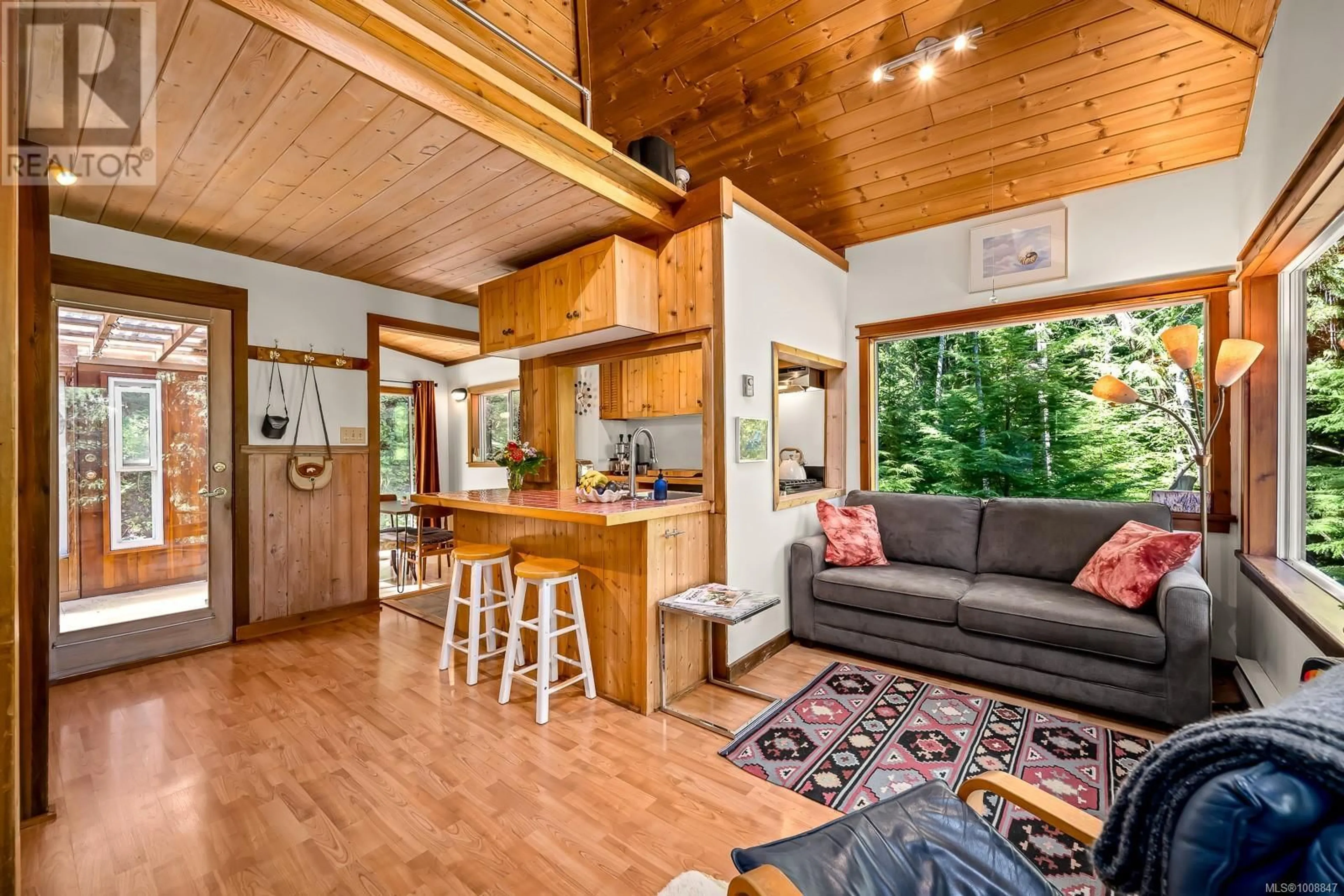 Open concept kitchen, wood/laminate floor for 838 SUTIL POINT ROAD, Cortes Island British Columbia V0P1K0