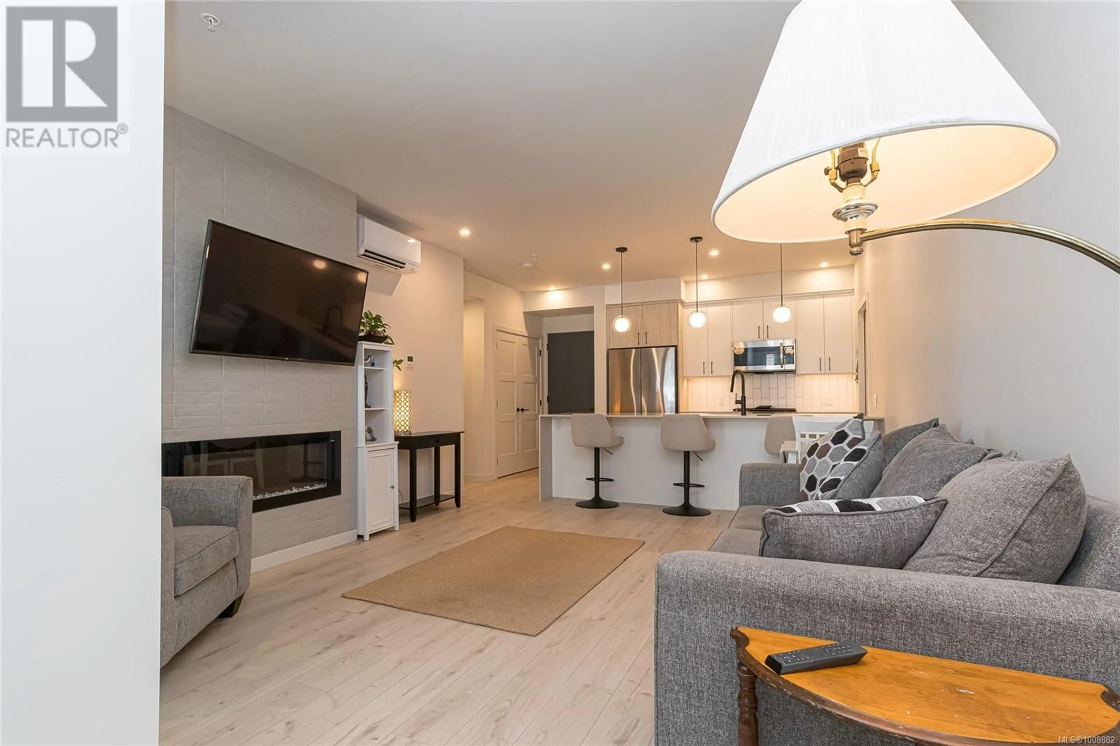 Living room with furniture, wood/laminate floor for 208 - 958 PHAROAH MEWS, Langford British Columbia V9B6W6