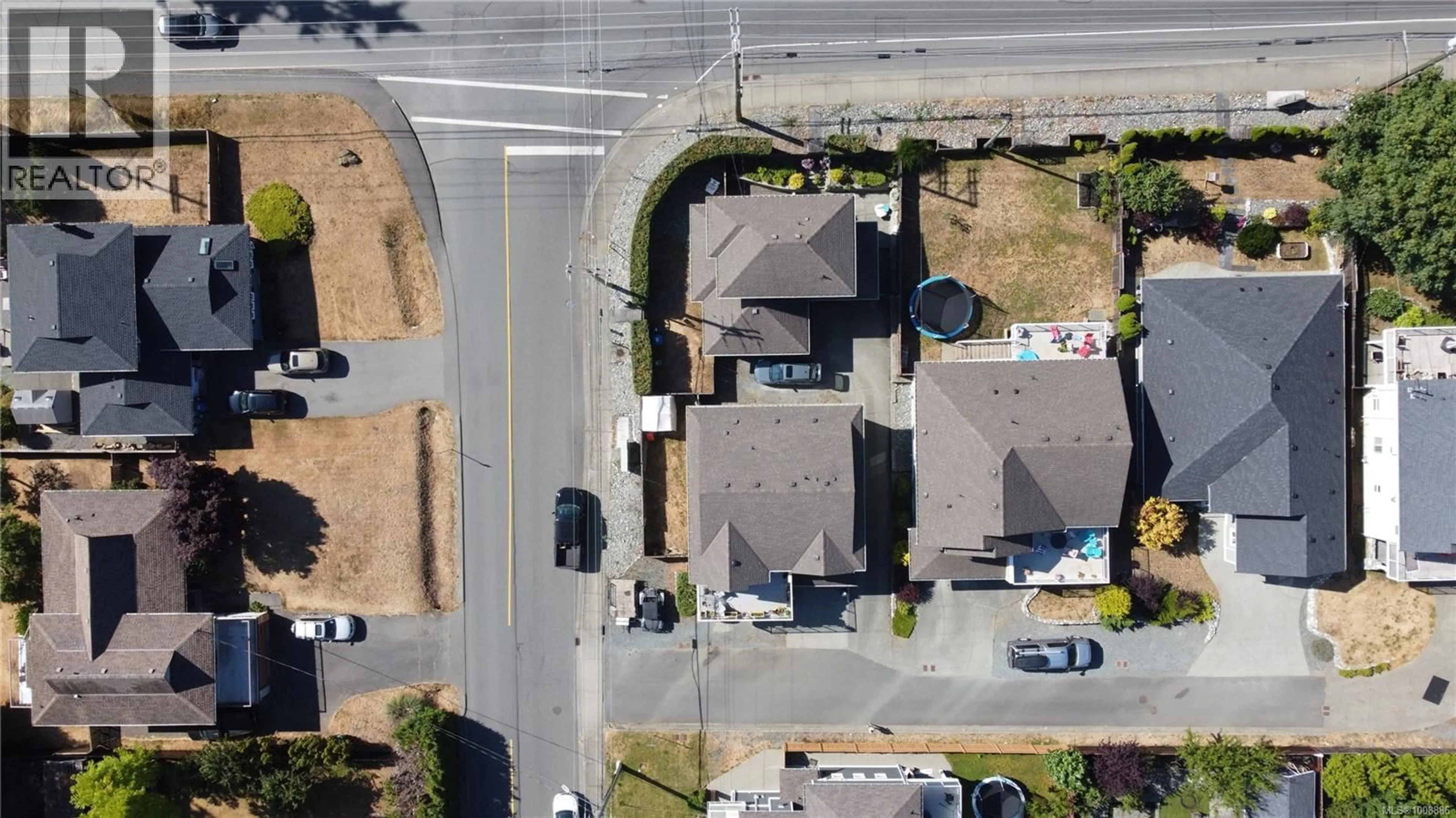 A pic from outside/outdoor area/front of a property/back of a property/a pic from drone, street for 5611 NORASEA ROAD, Nanaimo British Columbia V9V1G4