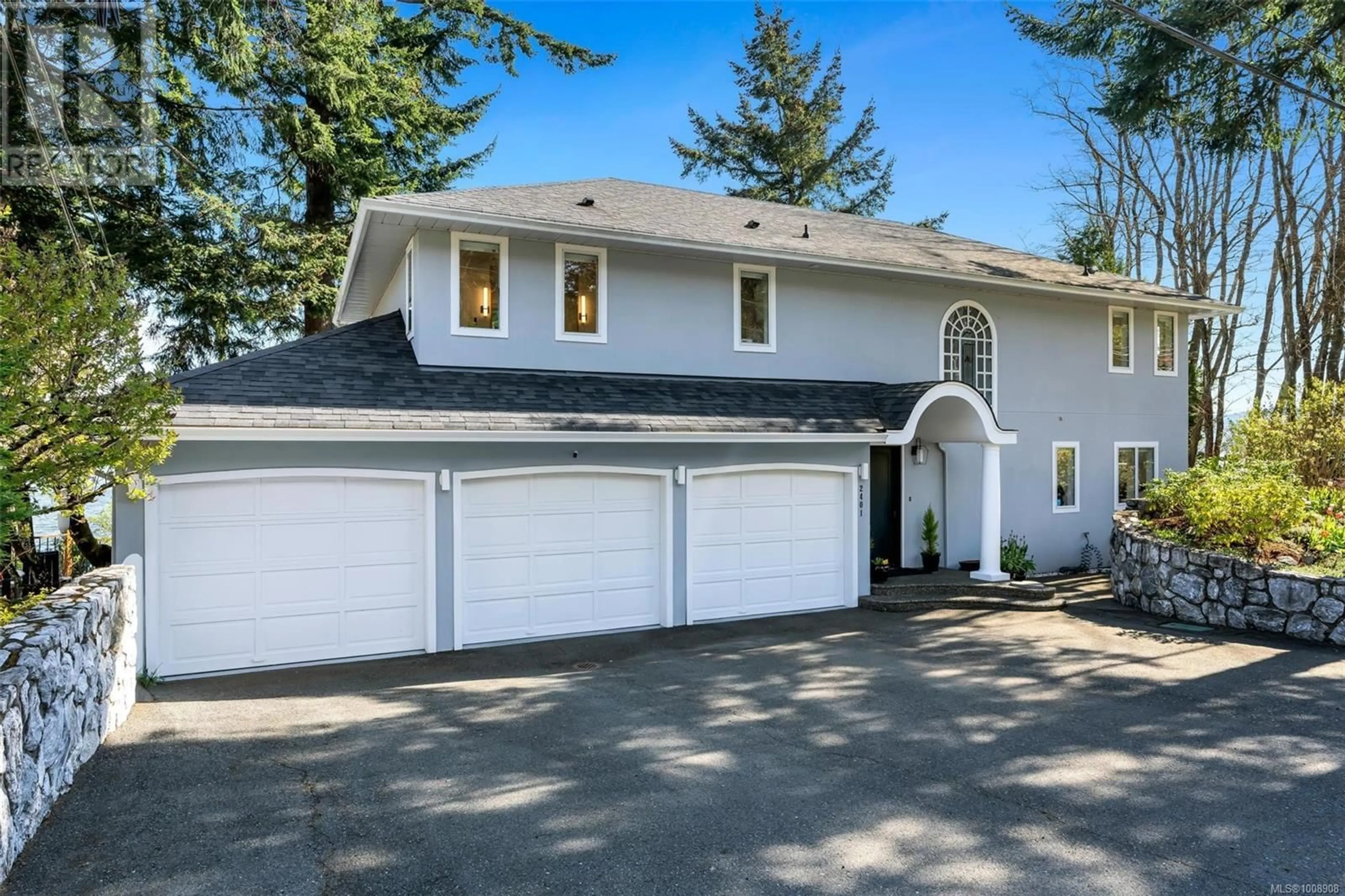 Home with vinyl exterior material, street for 2401 MILL BAY ROAD, Mill Bay British Columbia V8H1B9