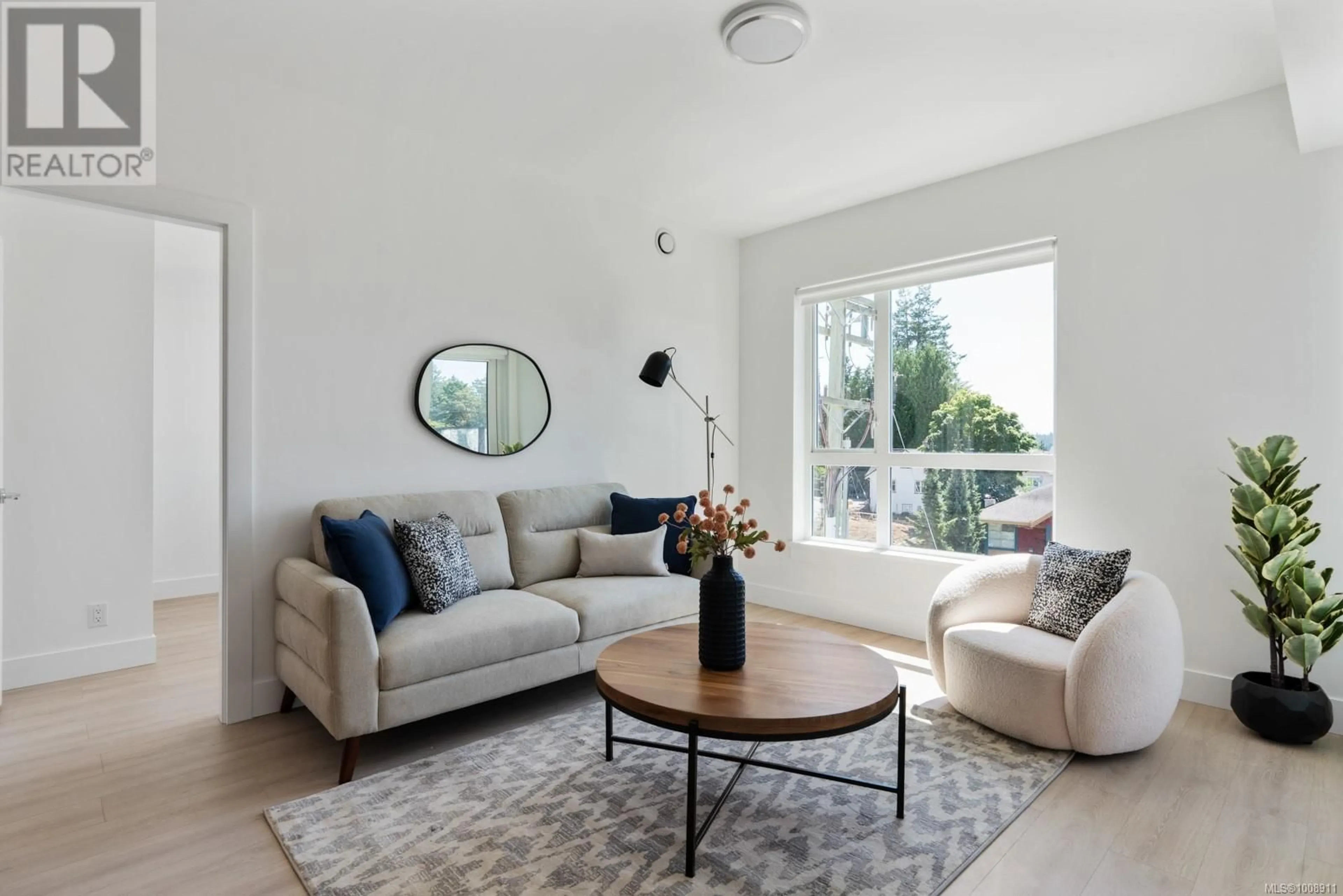 Living room with furniture, unknown for 606 - 258 HELMCKEN ROAD, View Royal British Columbia X0X0X0