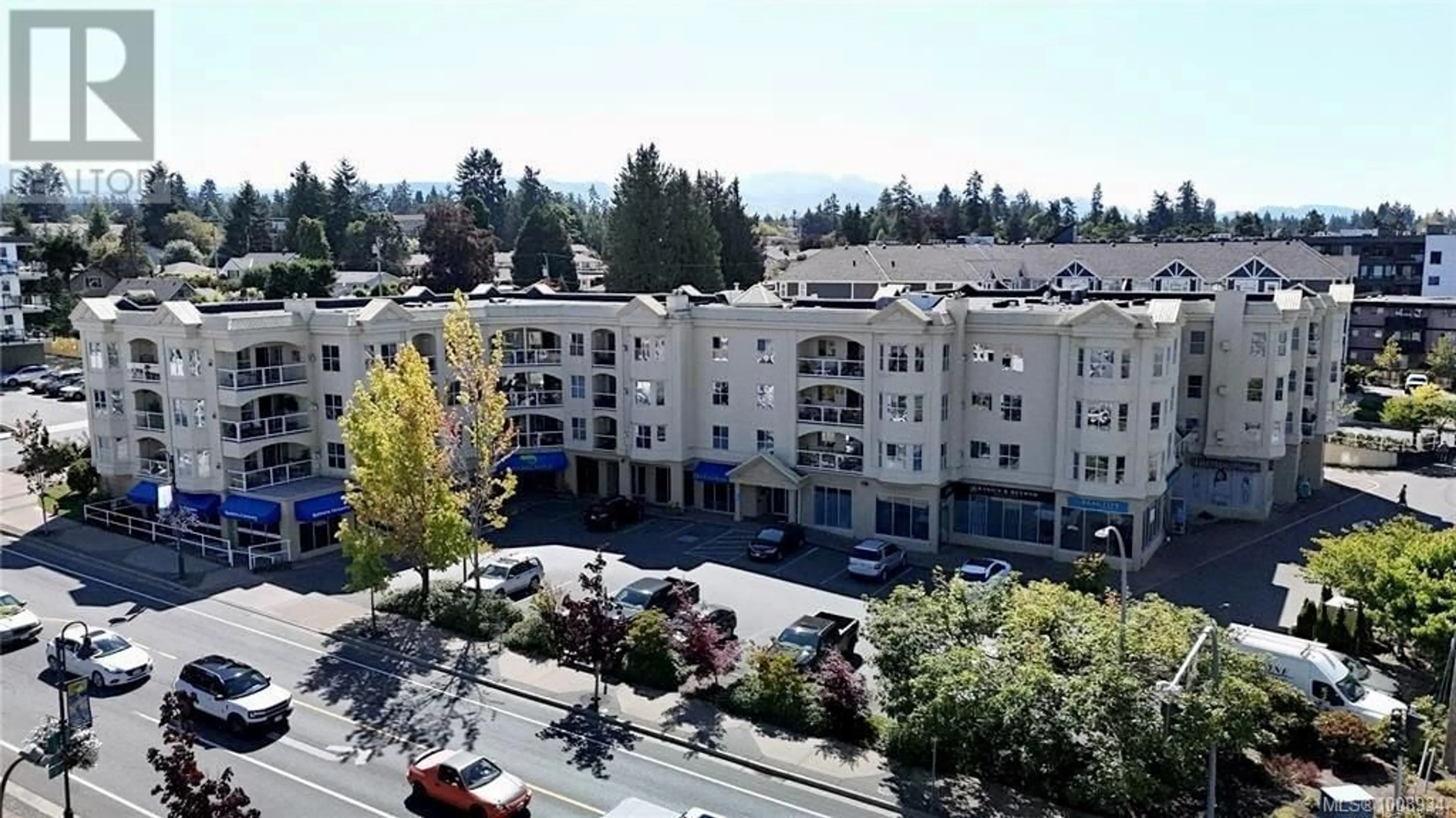 A pic from outside/outdoor area/front of a property/back of a property/a pic from drone, mountain view for 406 - 220 ISLAND HIGHWAY WEST, Parksville British Columbia V9P2P3