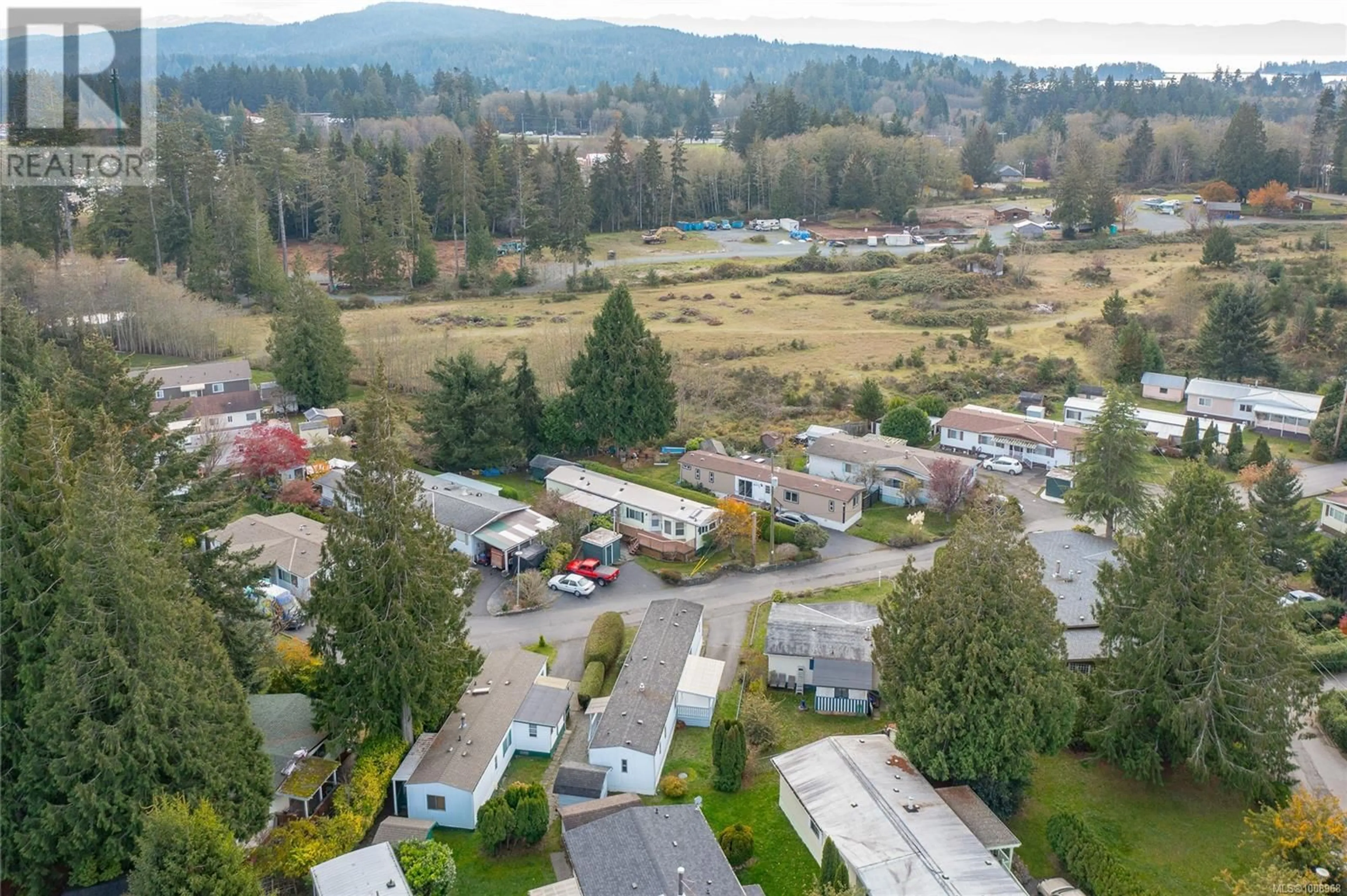 A pic from outside/outdoor area/front of a property/back of a property/a pic from drone, mountain view for 12 - 2357 SOOKE RIVER ROAD, Sooke British Columbia V9Z0X5