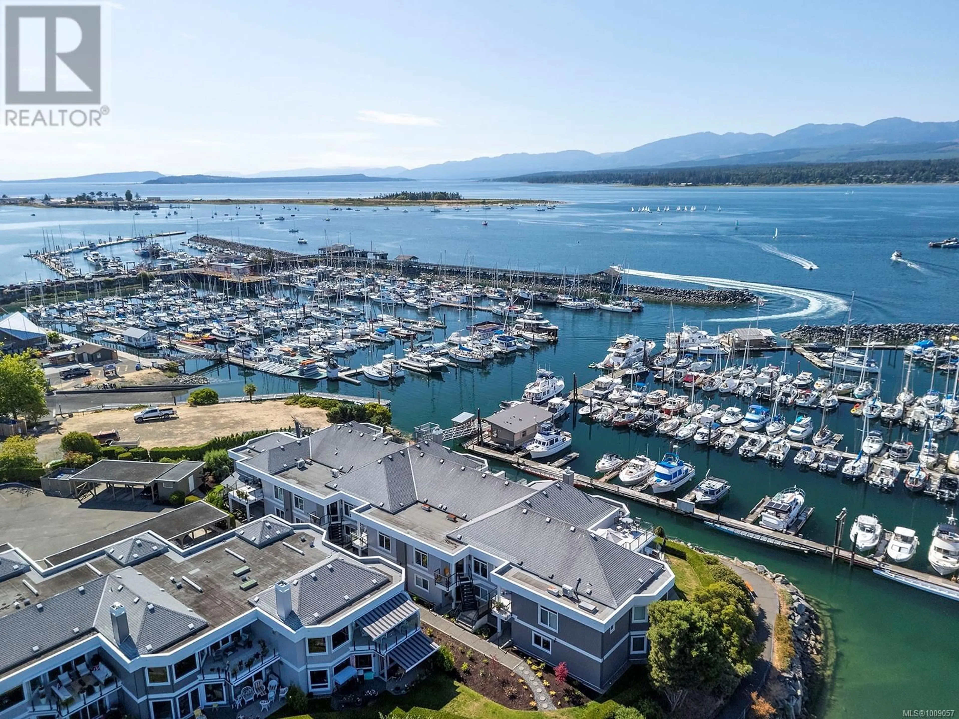 A pic from outside/outdoor area/front of a property/back of a property/a pic from drone, water/lake/river/ocean view for 108 - 1807 BEAUFORT AVENUE, Comox British Columbia V9M1R9