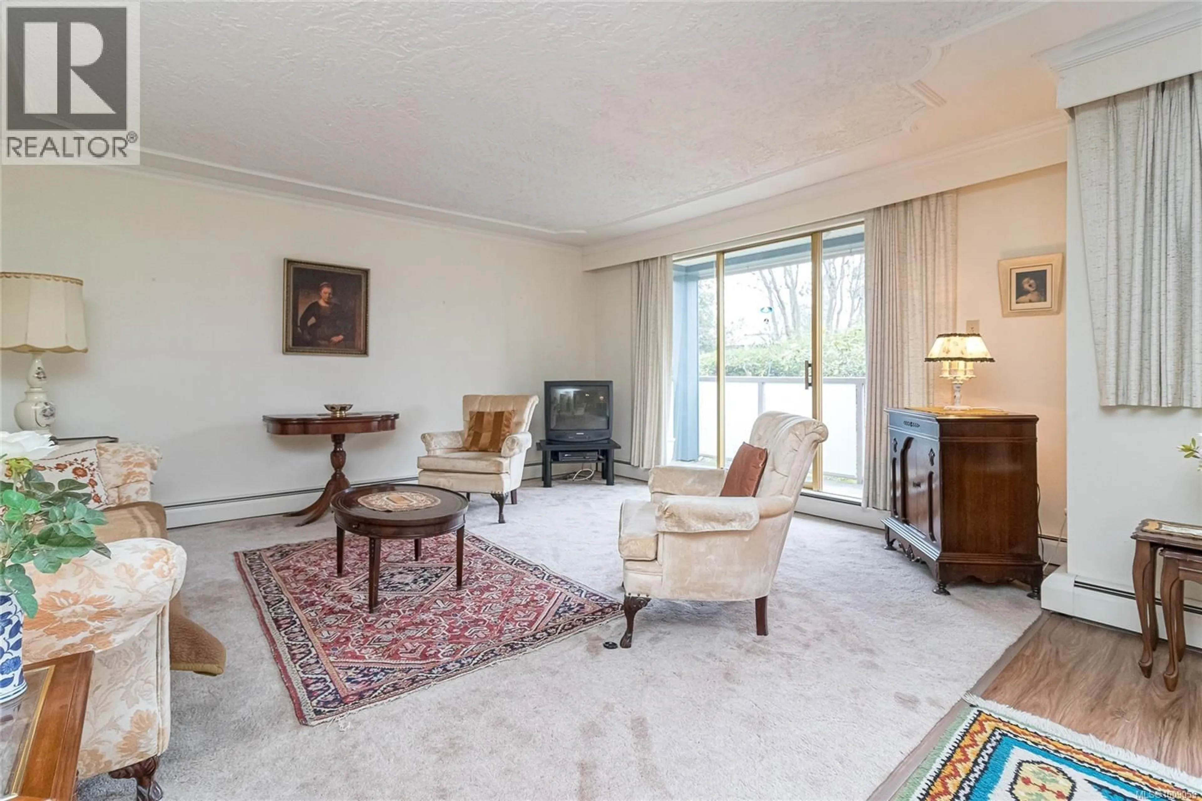 Living room with furniture, carpet floor for 302 - 1025 INVERNESS ROAD, Saanich British Columbia V8X2S2