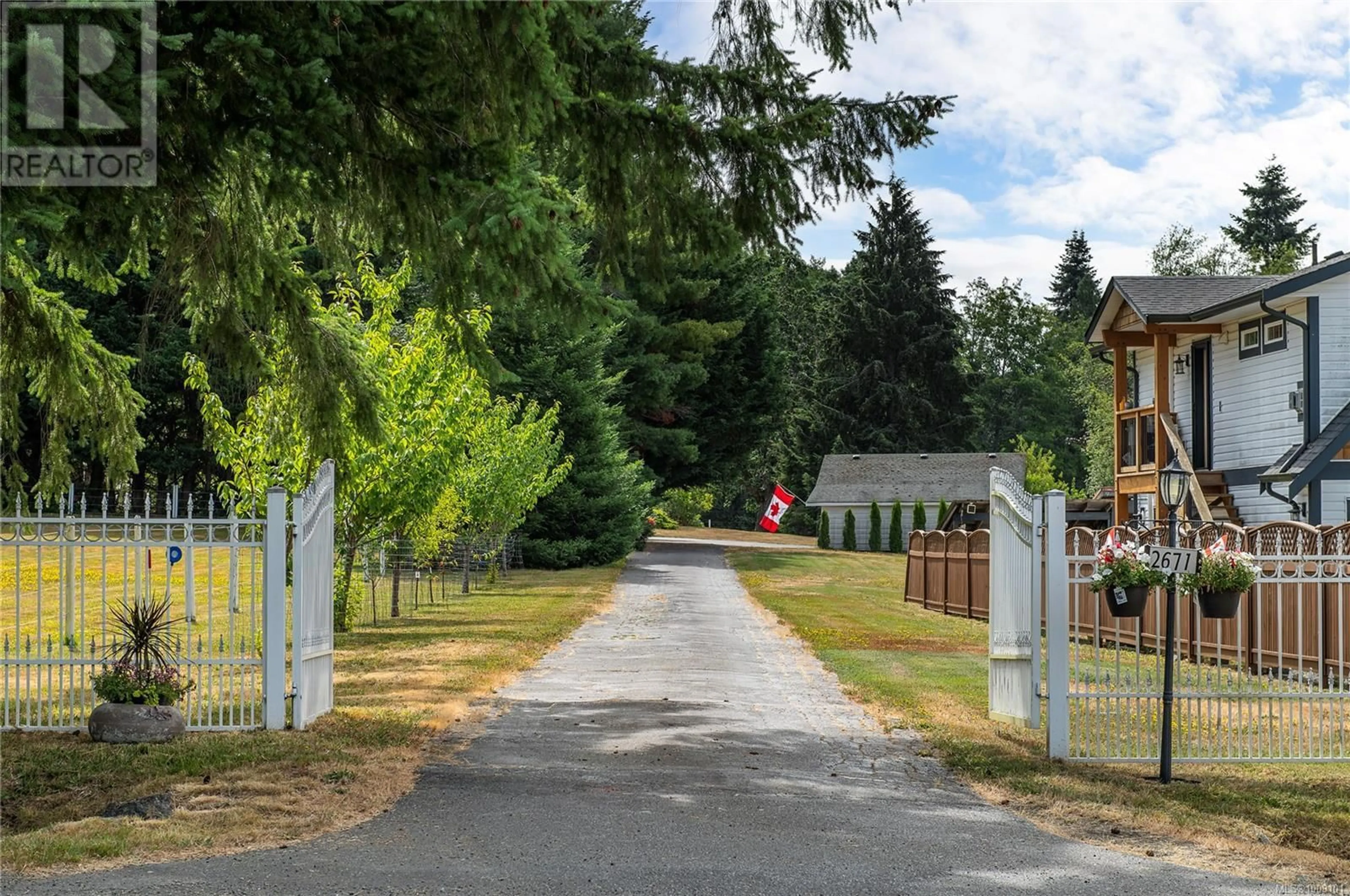 A pic from outside/outdoor area/front of a property/back of a property/a pic from drone, street for 2671 HUBAND ROAD, Courtenay British Columbia V9J1L4