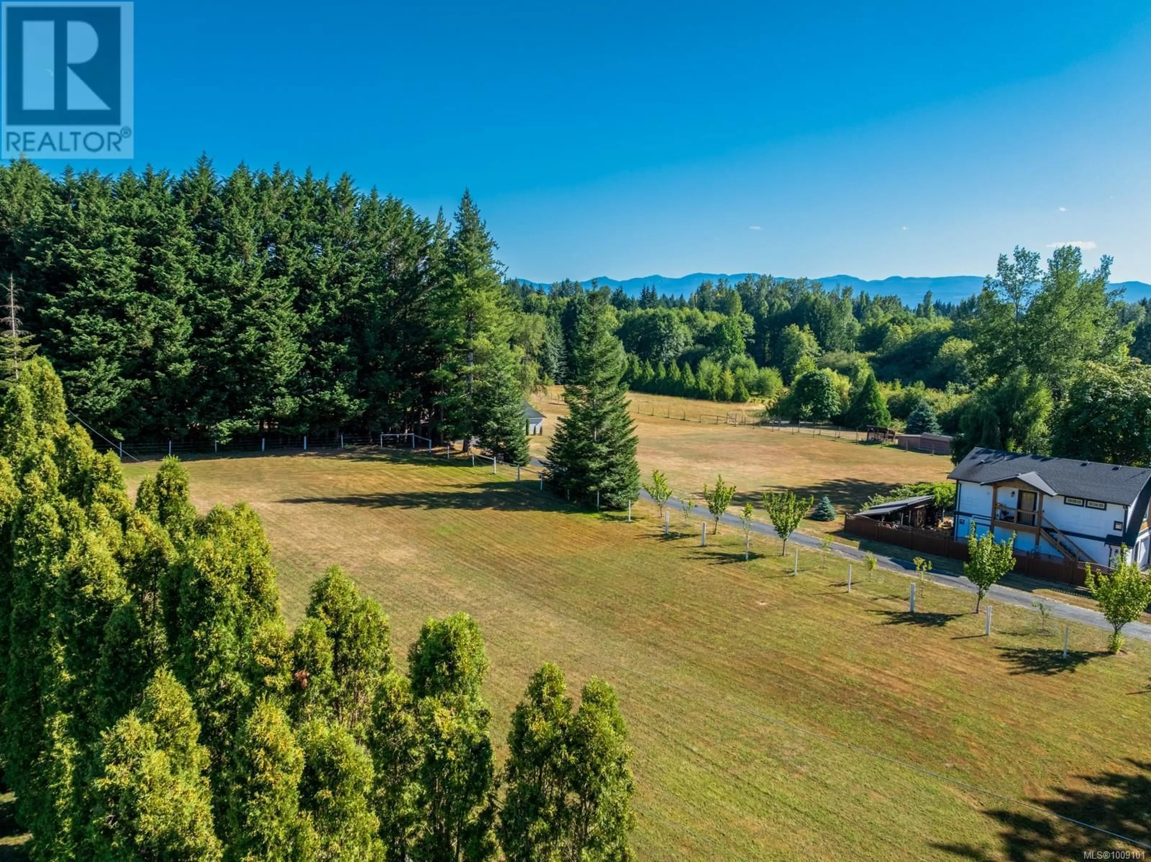A pic from outside/outdoor area/front of a property/back of a property/a pic from drone, water/lake/river/ocean view for 2671 HUBAND ROAD, Courtenay British Columbia V9J1L4