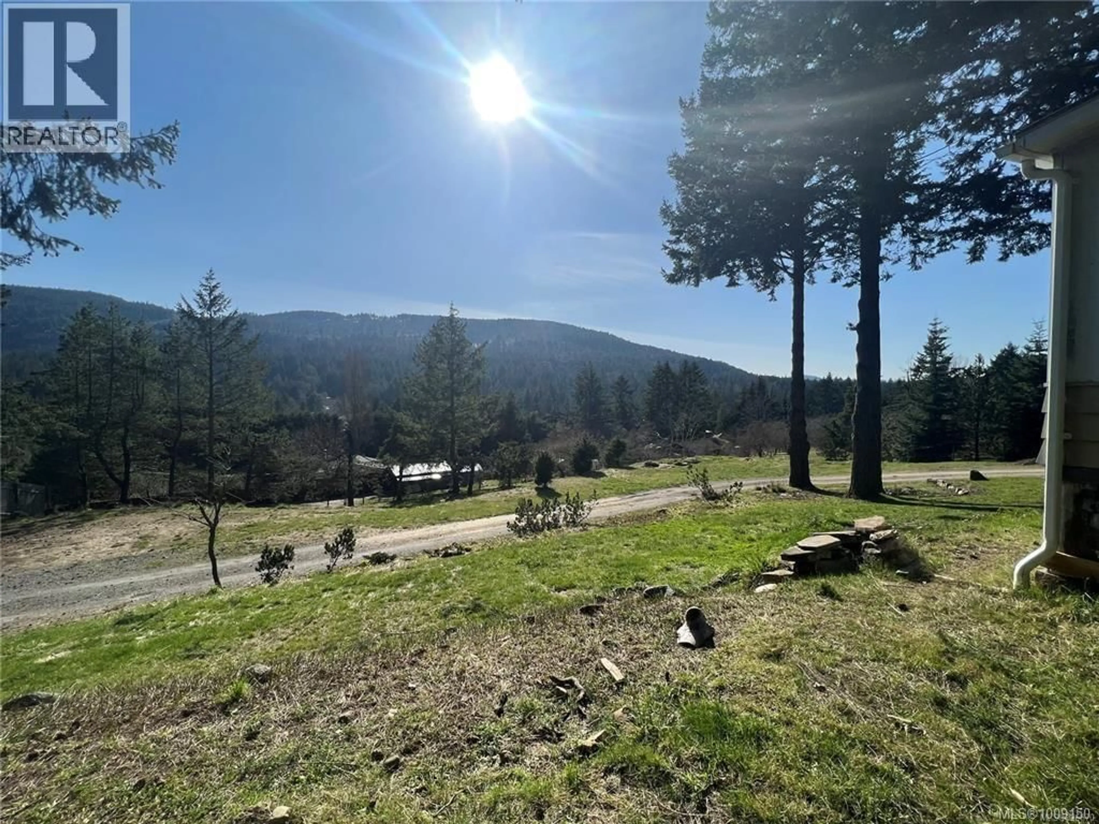 A pic from outside/outdoor area/front of a property/back of a property/a pic from drone, forest/trees view for 120 BOOTH CANAL ROAD, Salt Spring British Columbia V8K2N3
