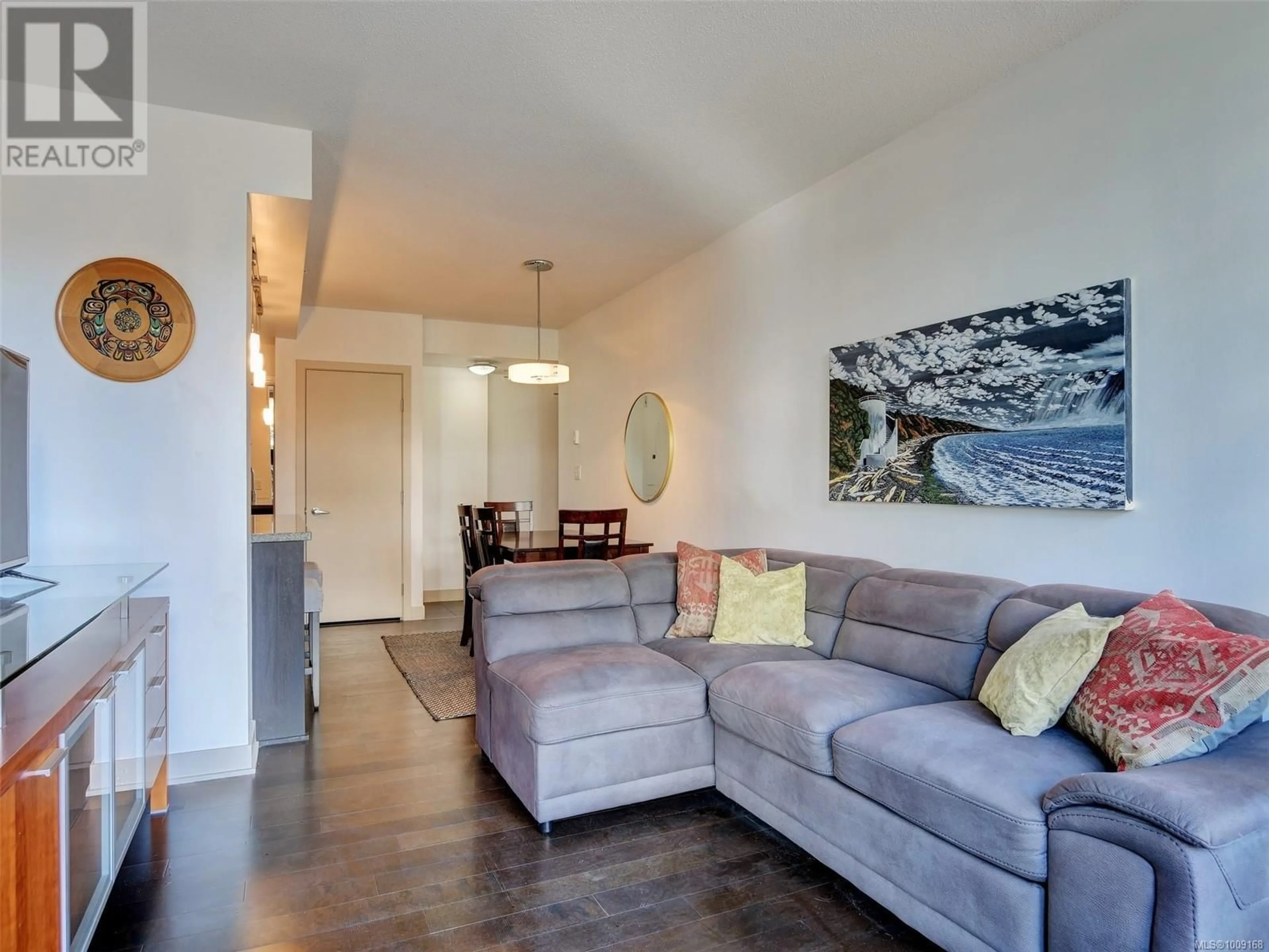 Living room with furniture, wood/laminate floor for 212 - 760 JOHNSON STREET, Victoria British Columbia V8W0A4