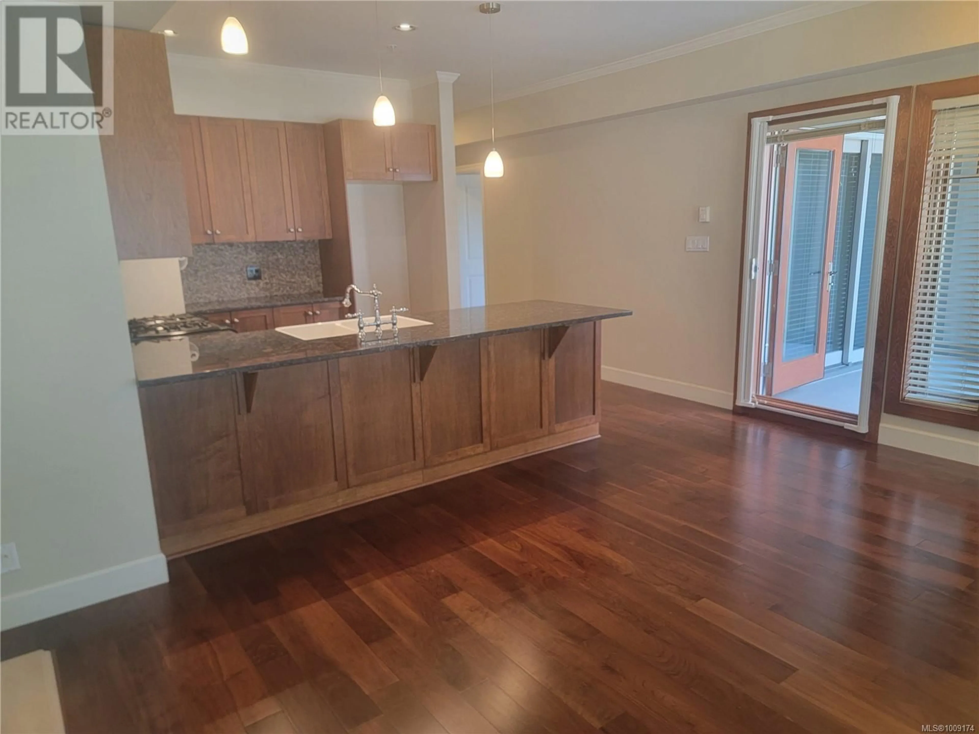 Open concept kitchen, wood/laminate floor for 205 - 2006 TROON COURT, Langford British Columbia V9B6T4