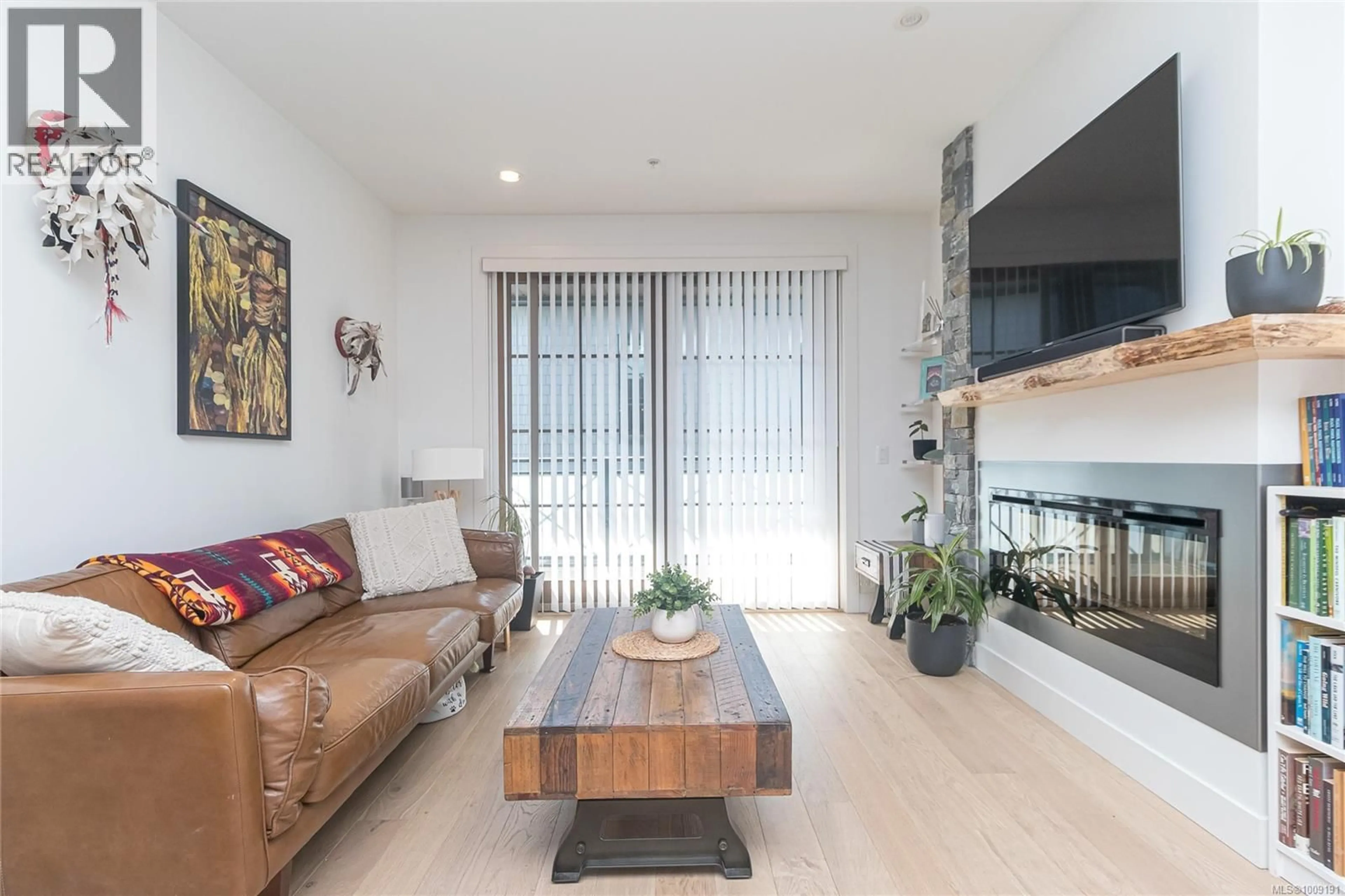 Living room with furniture, unknown for 204 - 2580 PENRHYN STREET, Saanich British Columbia V8N1G3