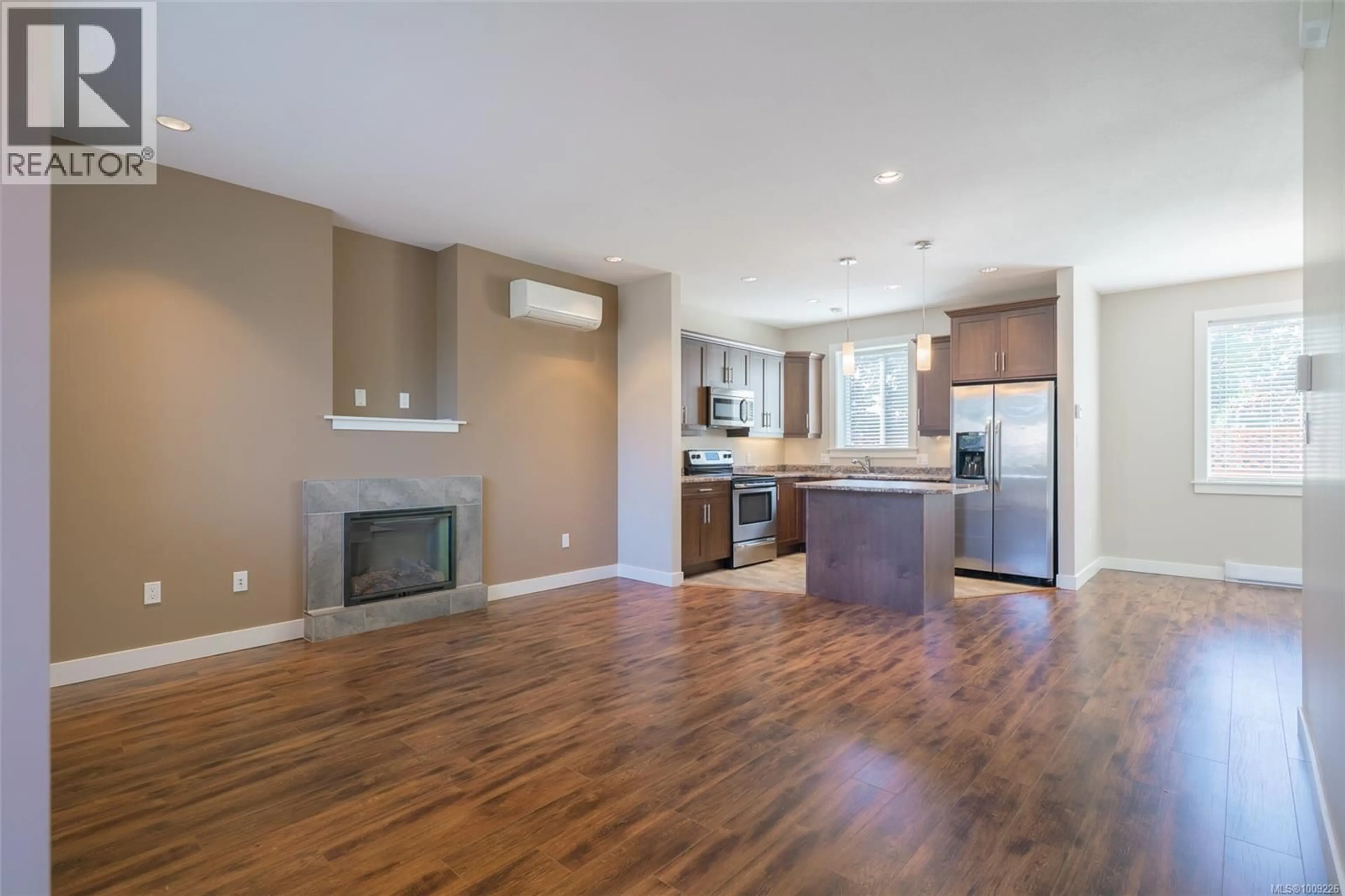 Open concept kitchen, wood/laminate floor for 4303 JINGLE POT ROAD, Nanaimo British Columbia V9T5P5