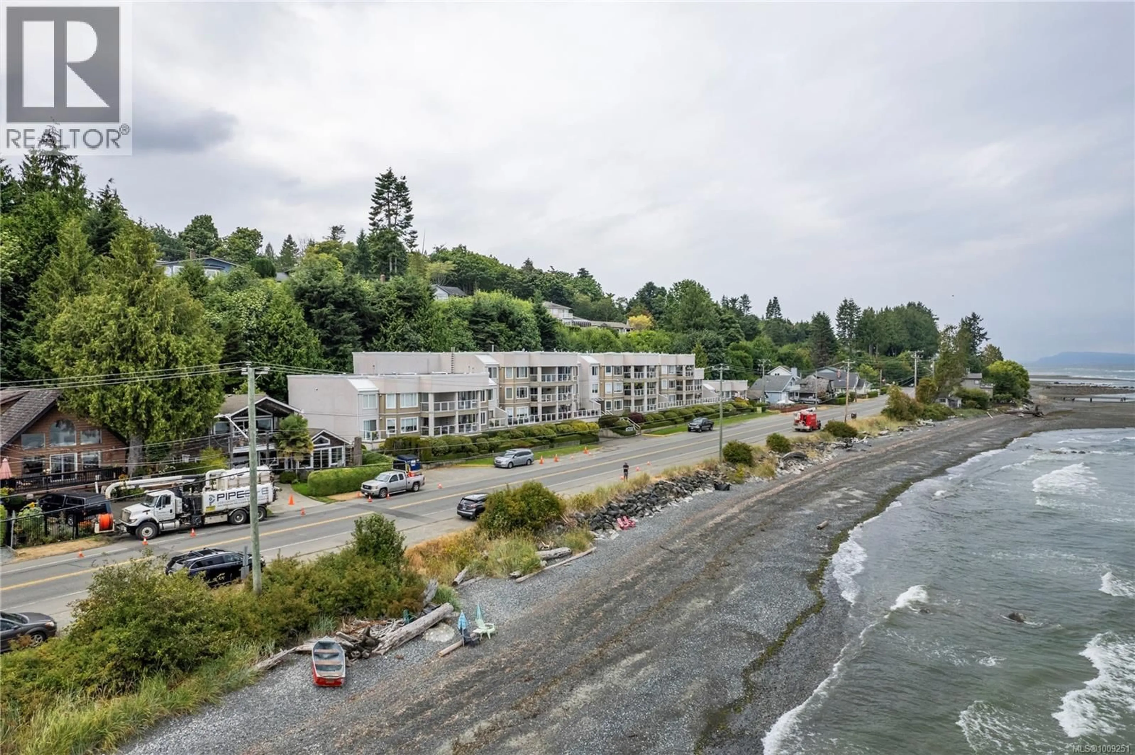 A pic from outside/outdoor area/front of a property/back of a property/a pic from drone, water/lake/river/ocean view for 301 - 3156 ISLAND HIGHWAY WEST, Qualicum Beach British Columbia V9K2J7