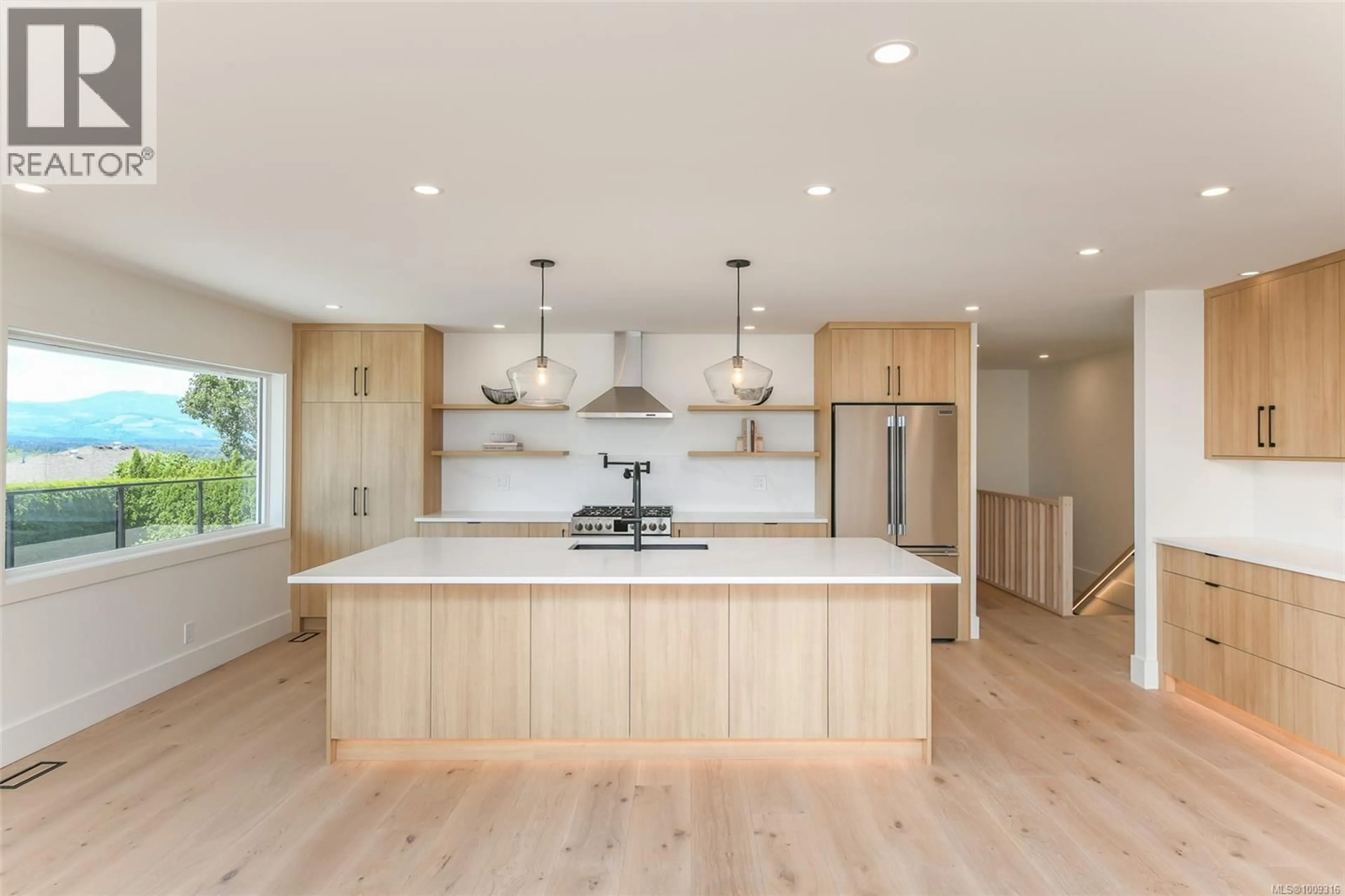 Open concept kitchen, wood/laminate floor for 1547 TRUMPETER CRESCENT, Courtenay British Columbia V9N8W6