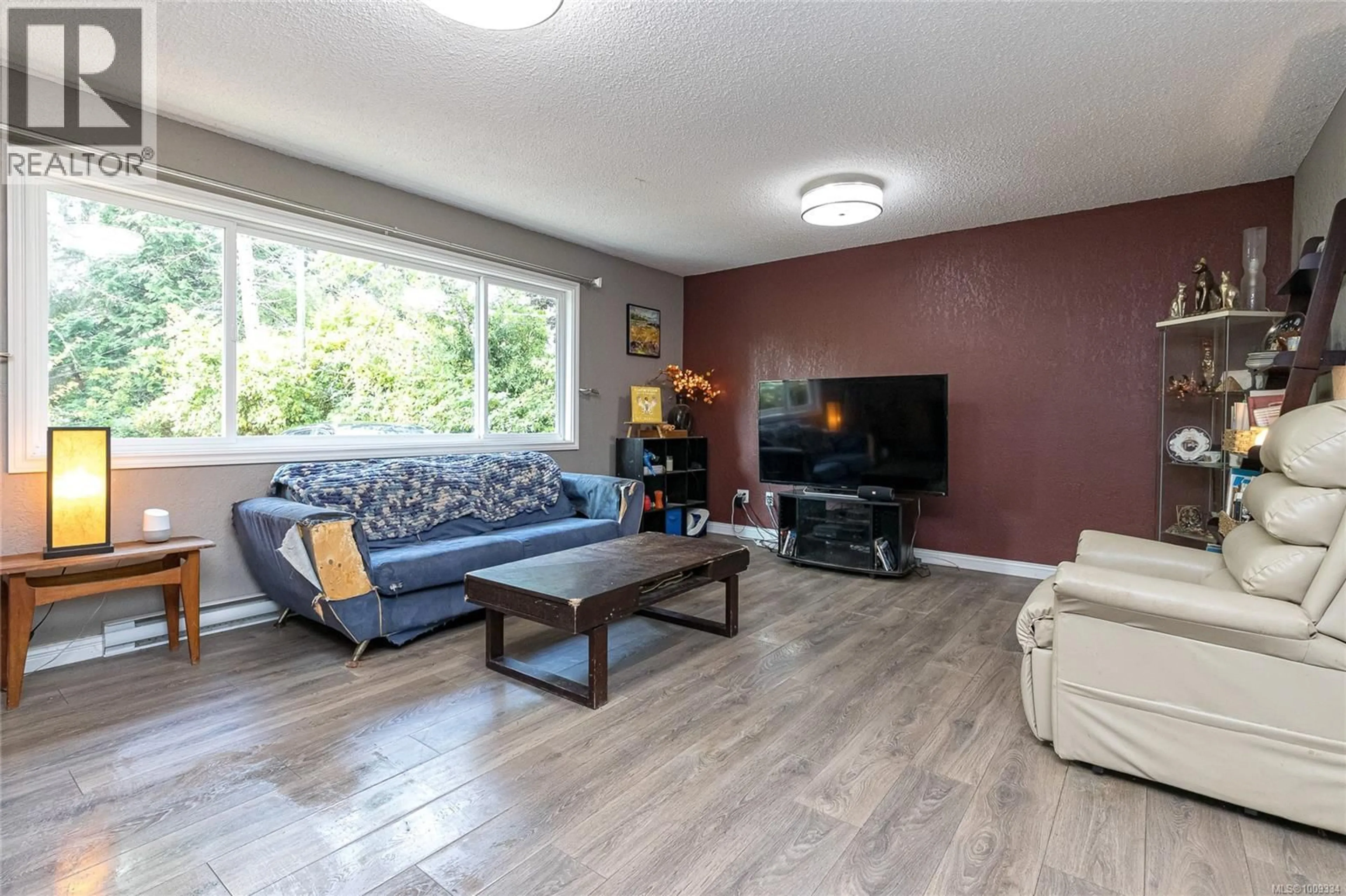 Living room with furniture, wood/laminate floor for 7068 WEST COAST ROAD, Sooke British Columbia V9Z0S4