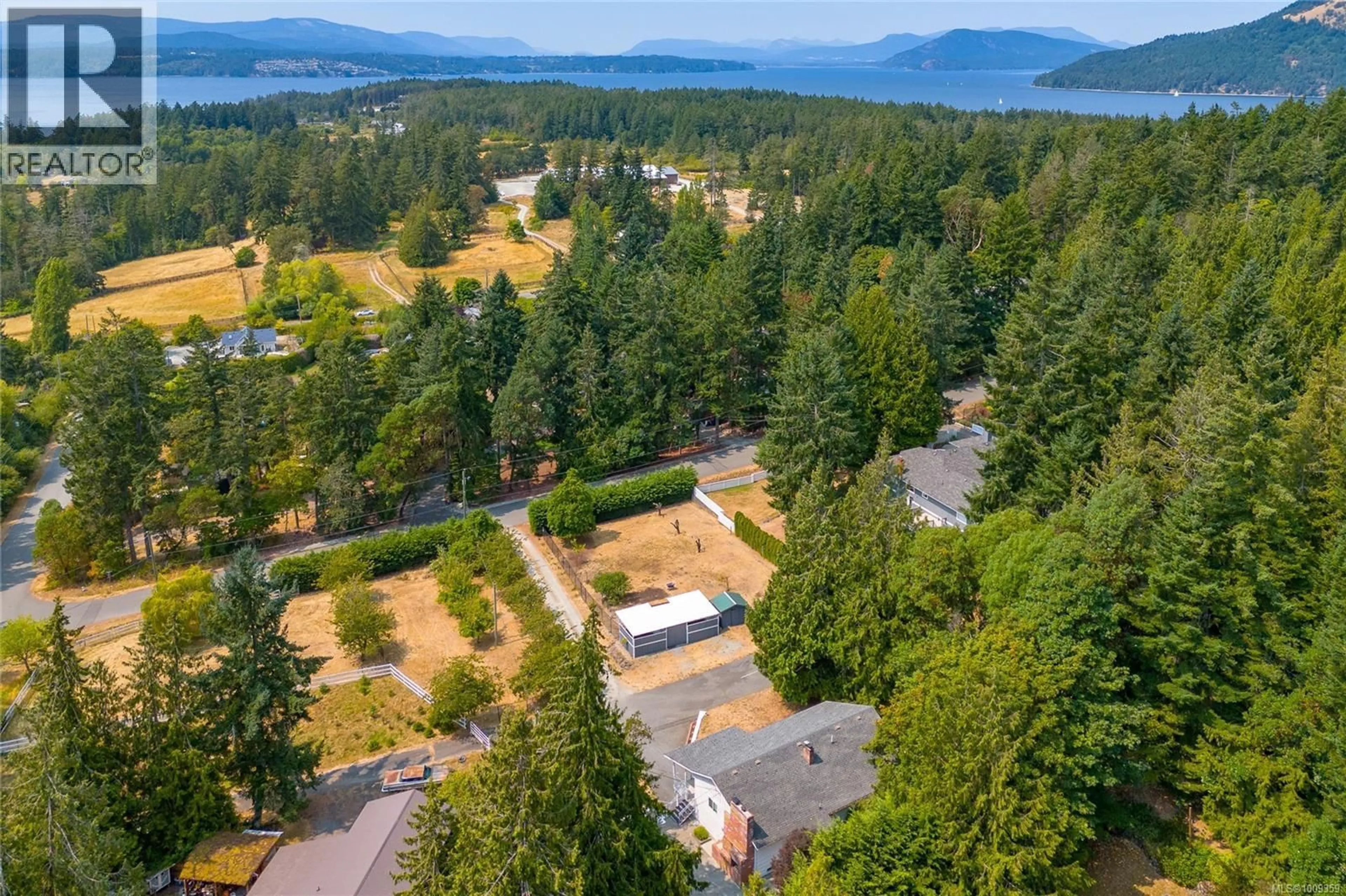 A pic from outside/outdoor area/front of a property/back of a property/a pic from drone, forest/trees view for 11255 NITINAT ROAD, North Saanich British Columbia V8L5R8