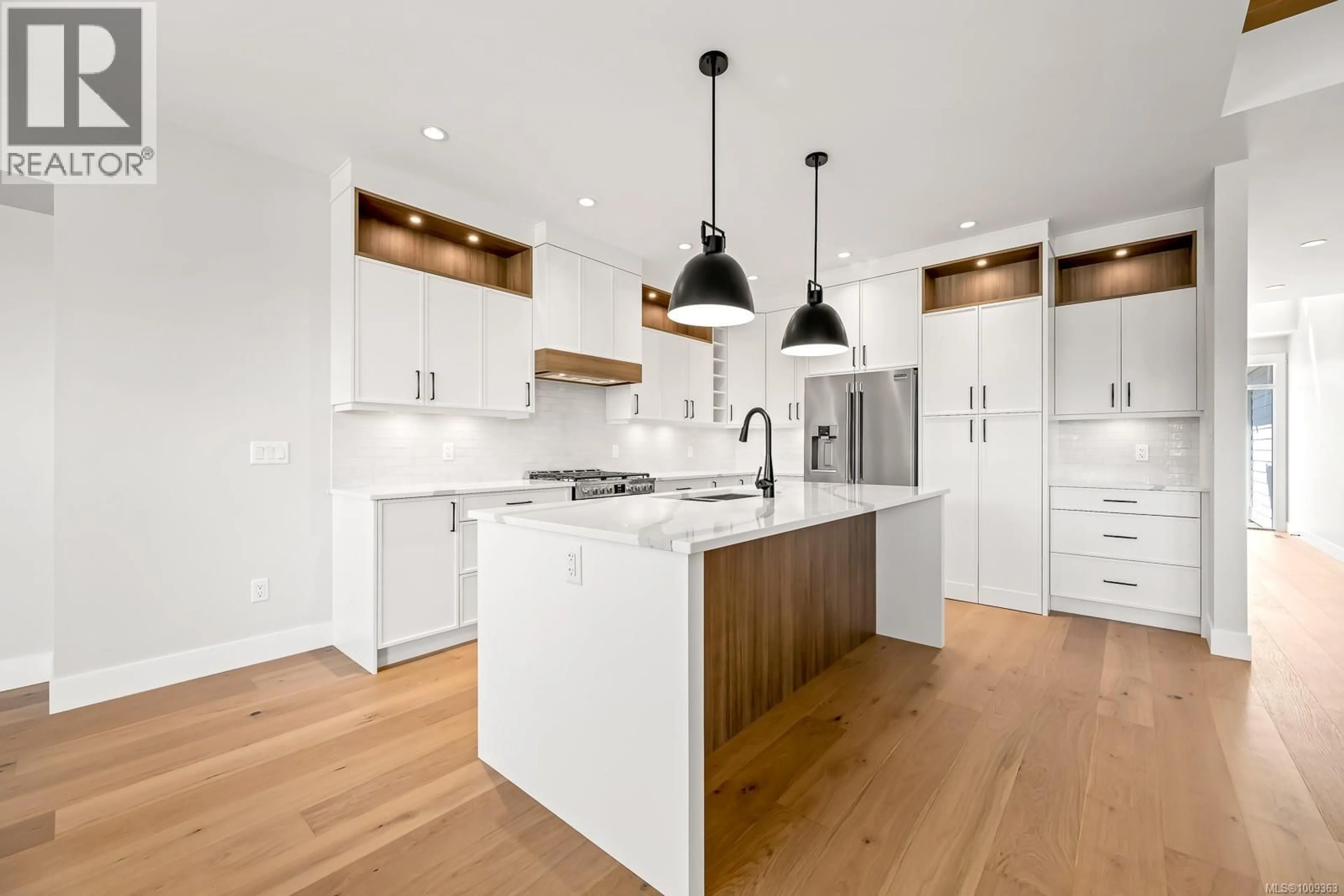 Open concept kitchen, wood/laminate floor for 3280 MARYGROVE PLACE, Courtenay British Columbia V9N0E7