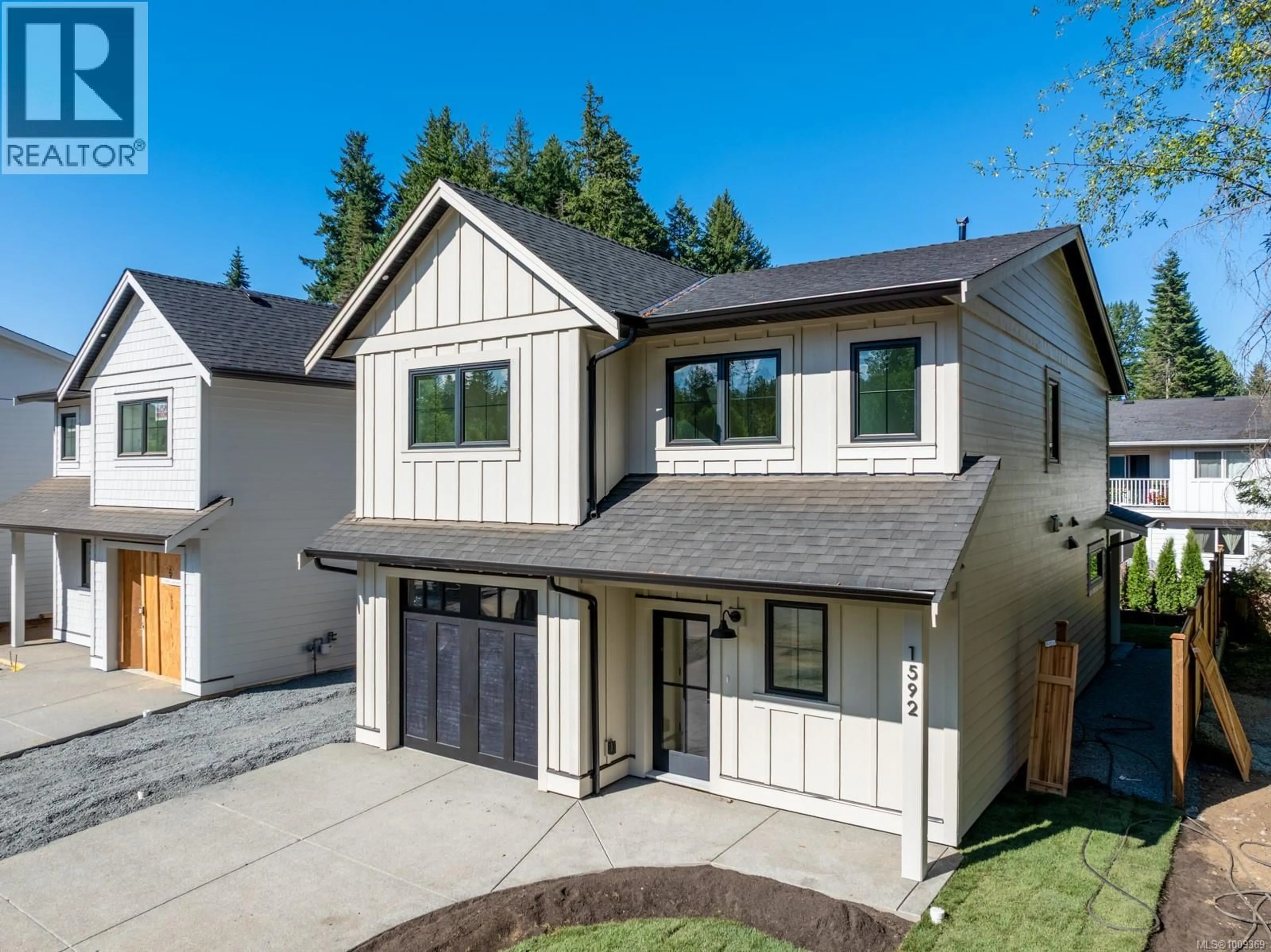 Home with vinyl exterior material, street for 1592 LARSEN ROAD, Courtenay British Columbia V9N8Y9
