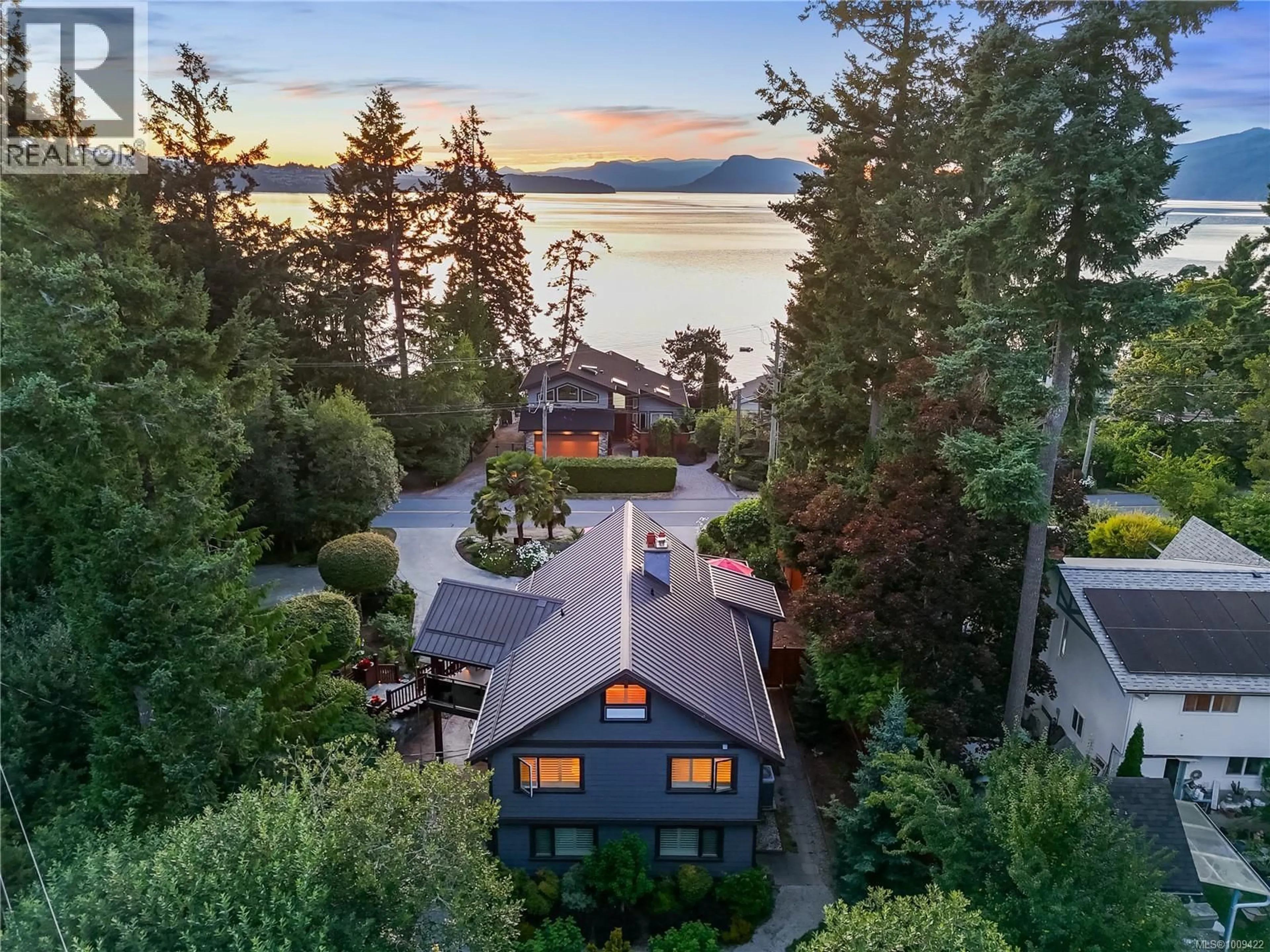 A pic from outside/outdoor area/front of a property/back of a property/a pic from drone, water/lake/river/ocean view for 10879 MADRONA DRIVE, North Saanich British Columbia V8L5N9