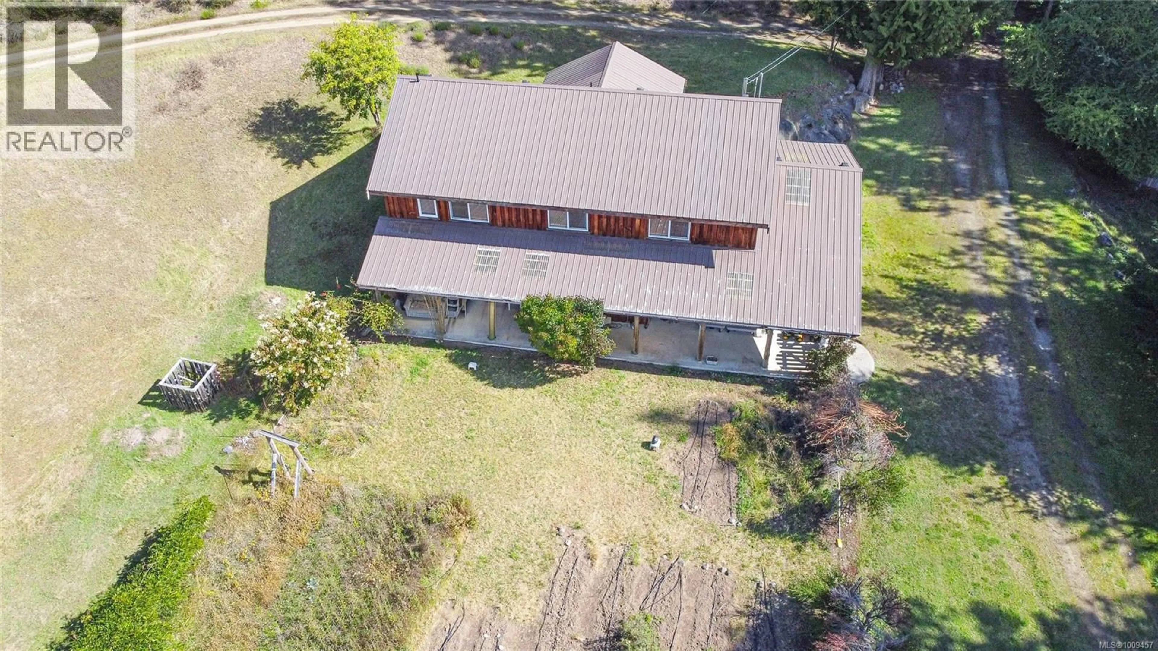 A pic from outside/outdoor area/front of a property/back of a property/a pic from drone, building for 415 CAMPBELL BAY ROAD, Mayne Island British Columbia V0N2J0